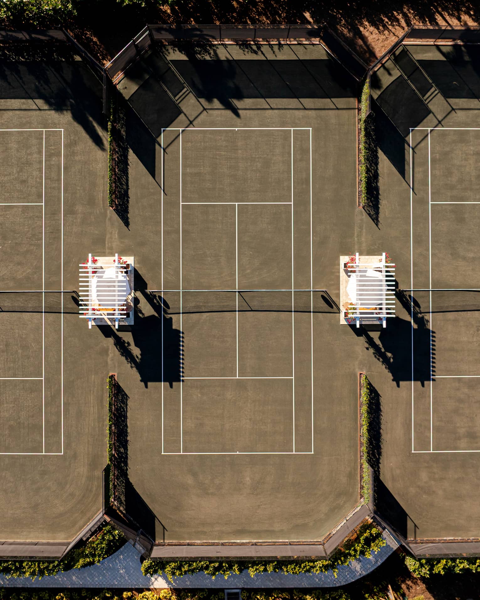 Aerial view of three outdoor tennis courts