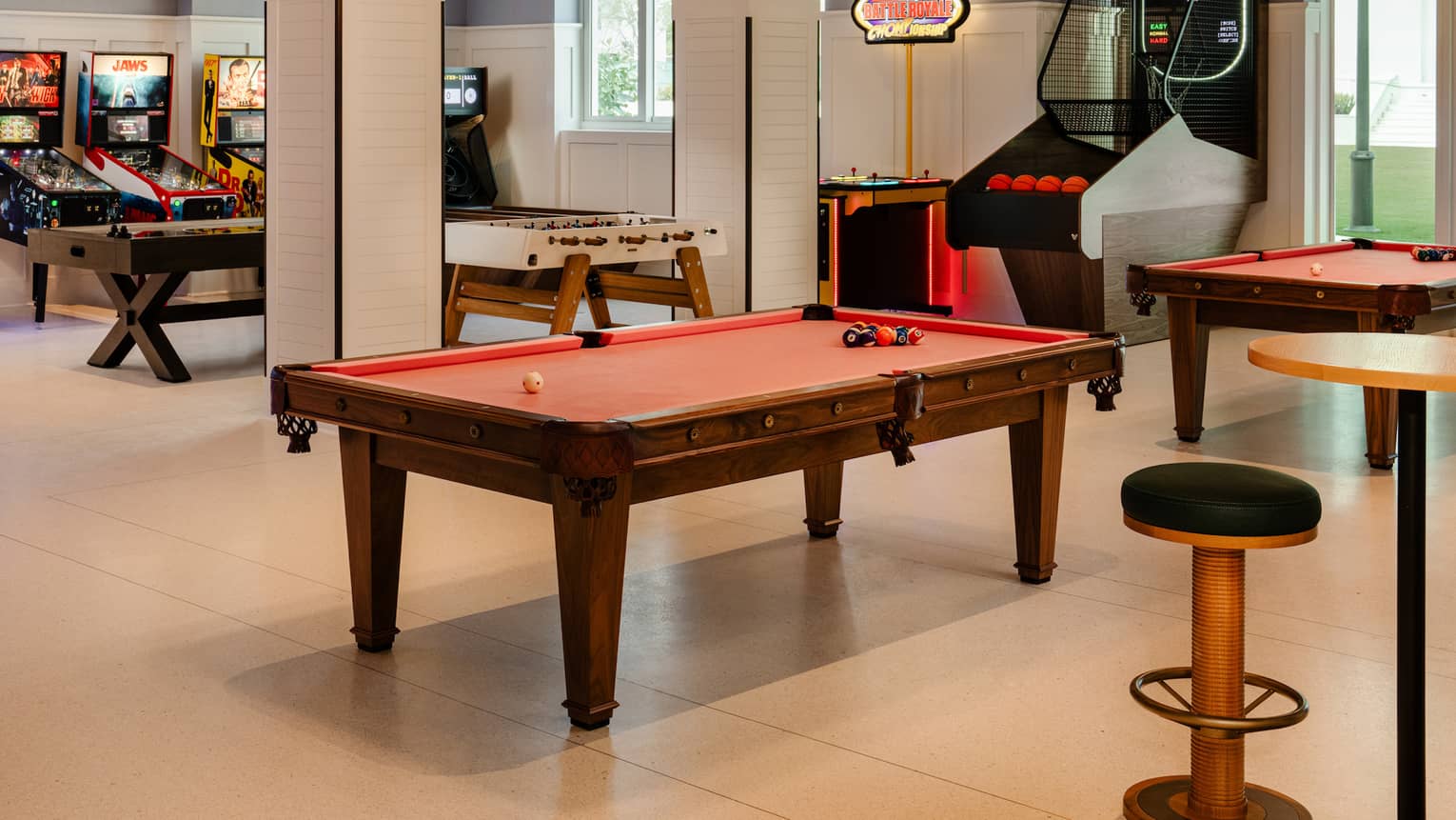Game room with pool tables and arcade games