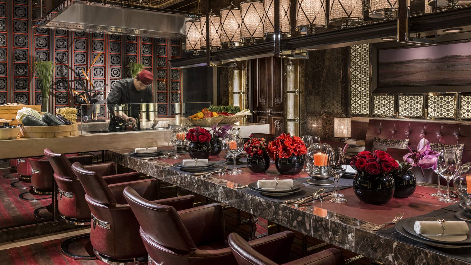 A chef preparing seasonal courses at the Chef’s Table in Four Seasons Hotel Beijing. 