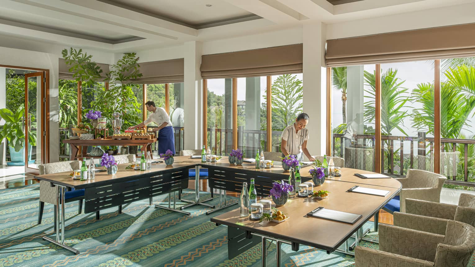 Chef and team member prepare Khob Fah meeting room for an event