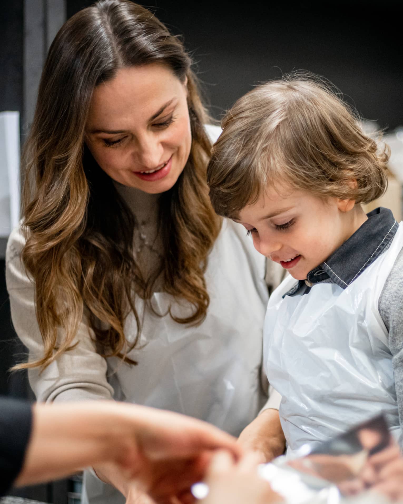 A family doing an activity in a kitchen.