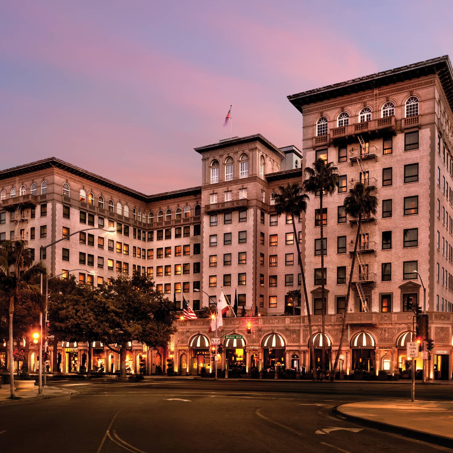 Beverly Wilshire, A Four Seasons Hotel building exterior, entrance at sunset
