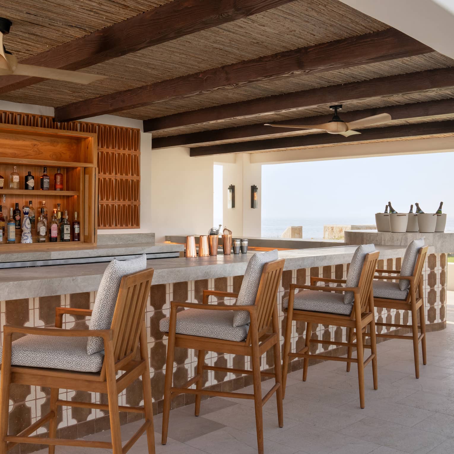 Outdoor, covered Brisol Pool Bar with ocean view at Four Seasons Cabo San Lucas at Cabo Del Sol