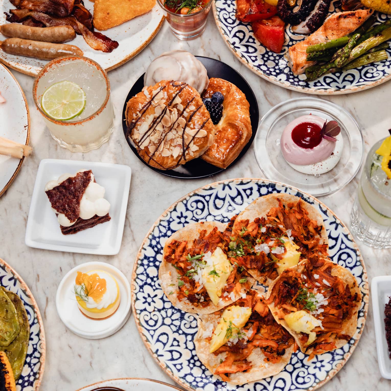 A colourful array of brunch dishes set out on a table