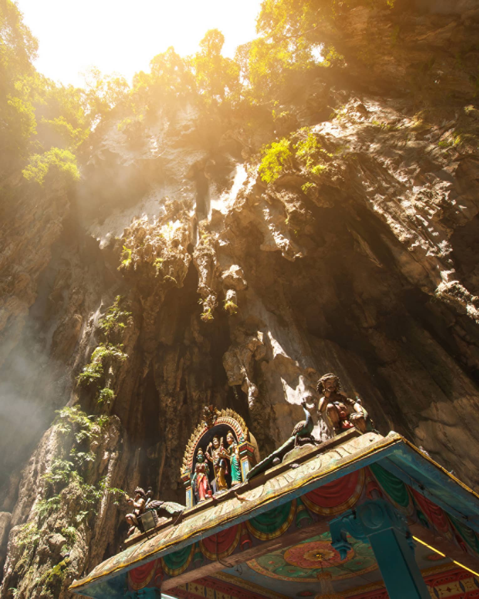 View looking up at rocks through Hindu temple at Batu caves in Malaysia