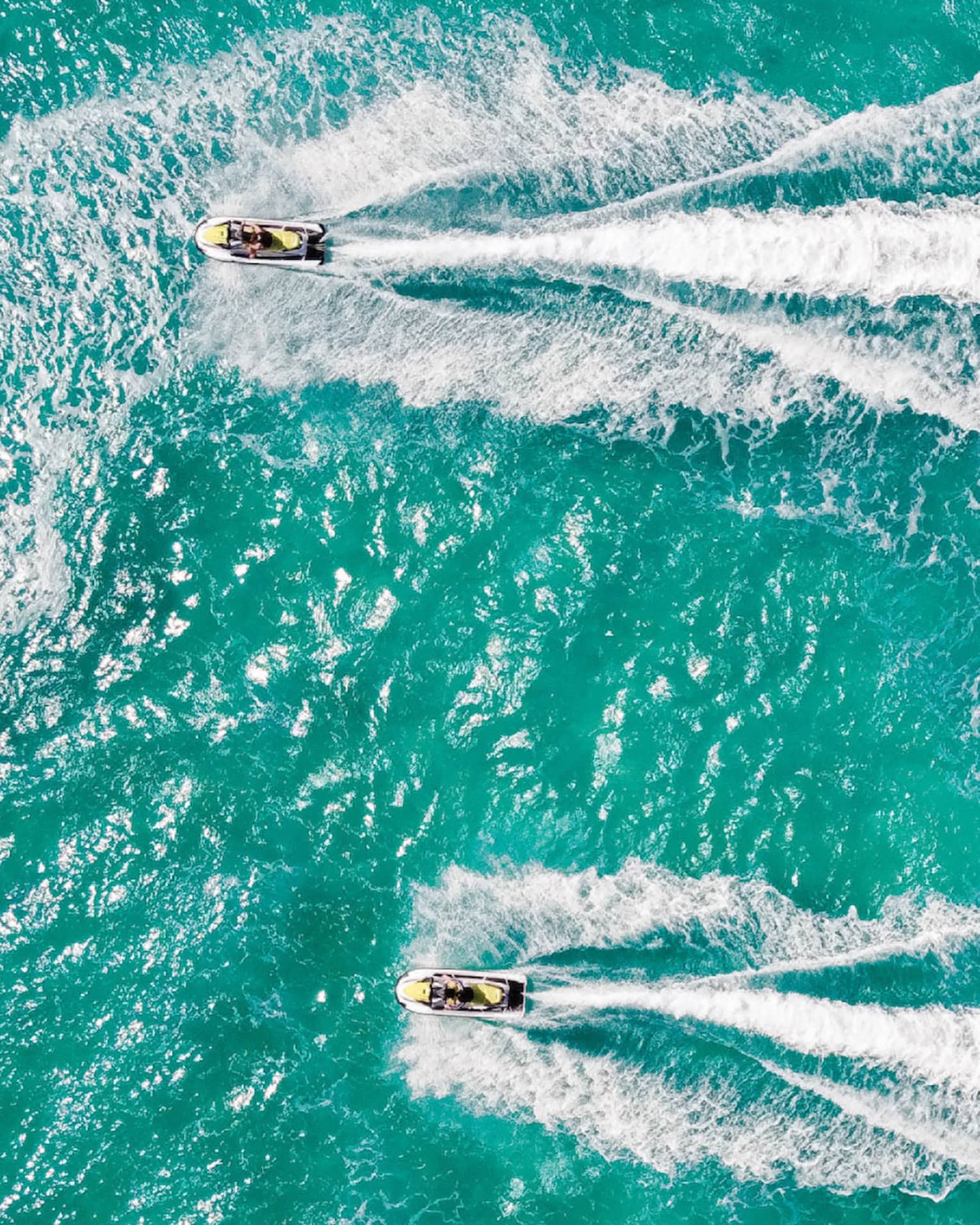 Aerial view of two people on jet skis