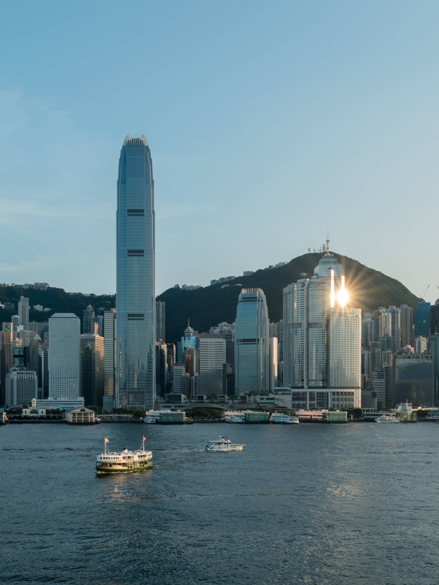Boats on harbour and Hong Kong city in the background