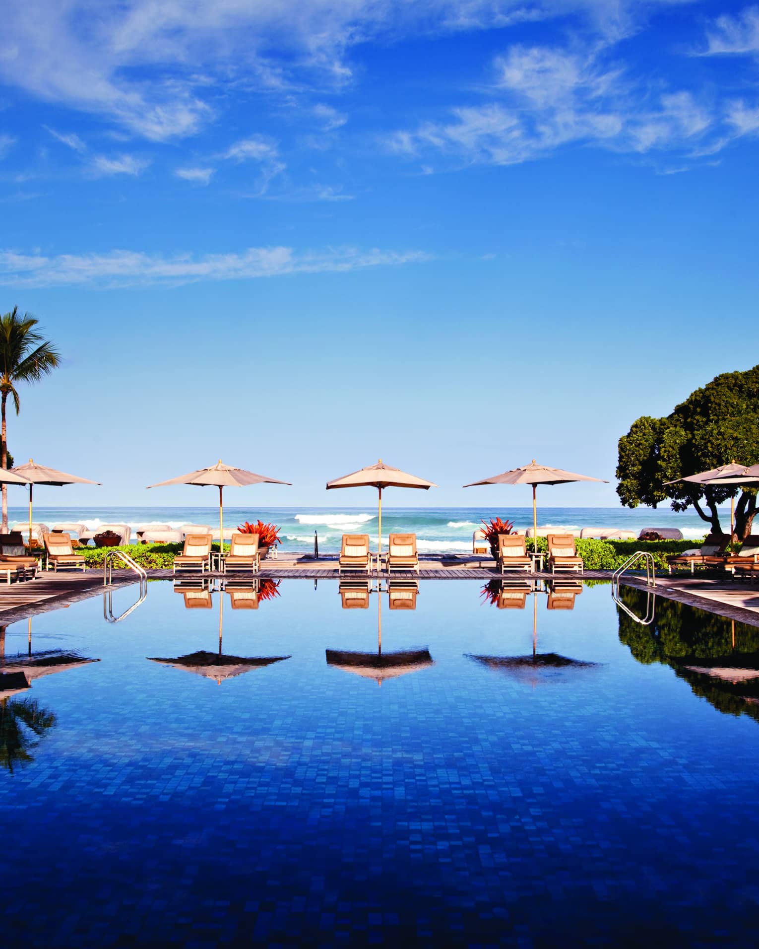 Tropical resort pool with cabanas