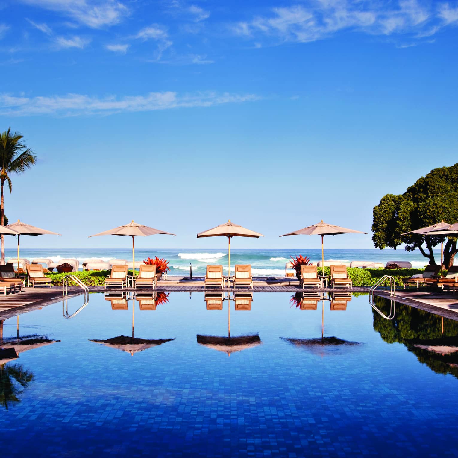 Tropical resort pool with cabanas