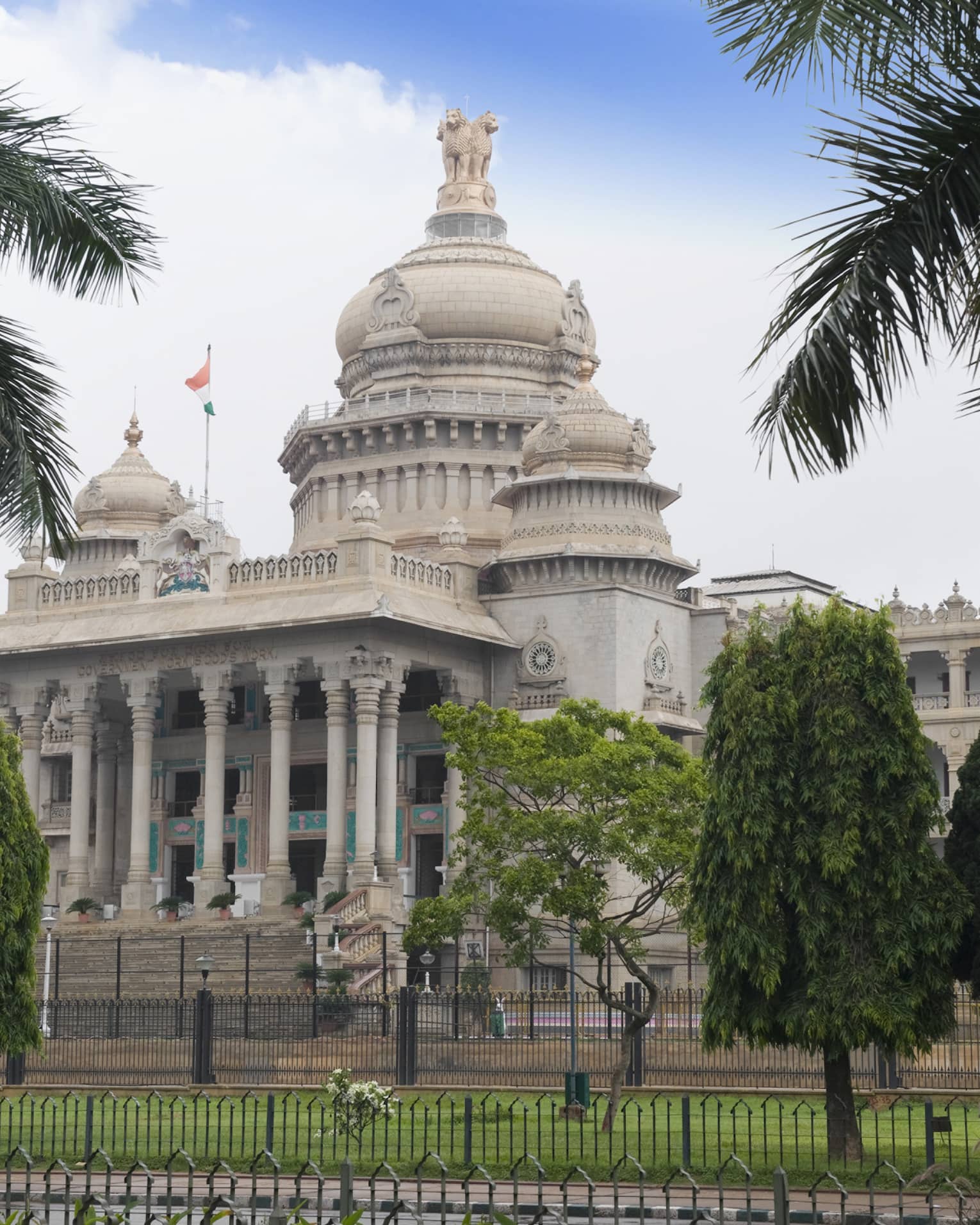 Palm trees in front of Vidhana Soudha government building exterior