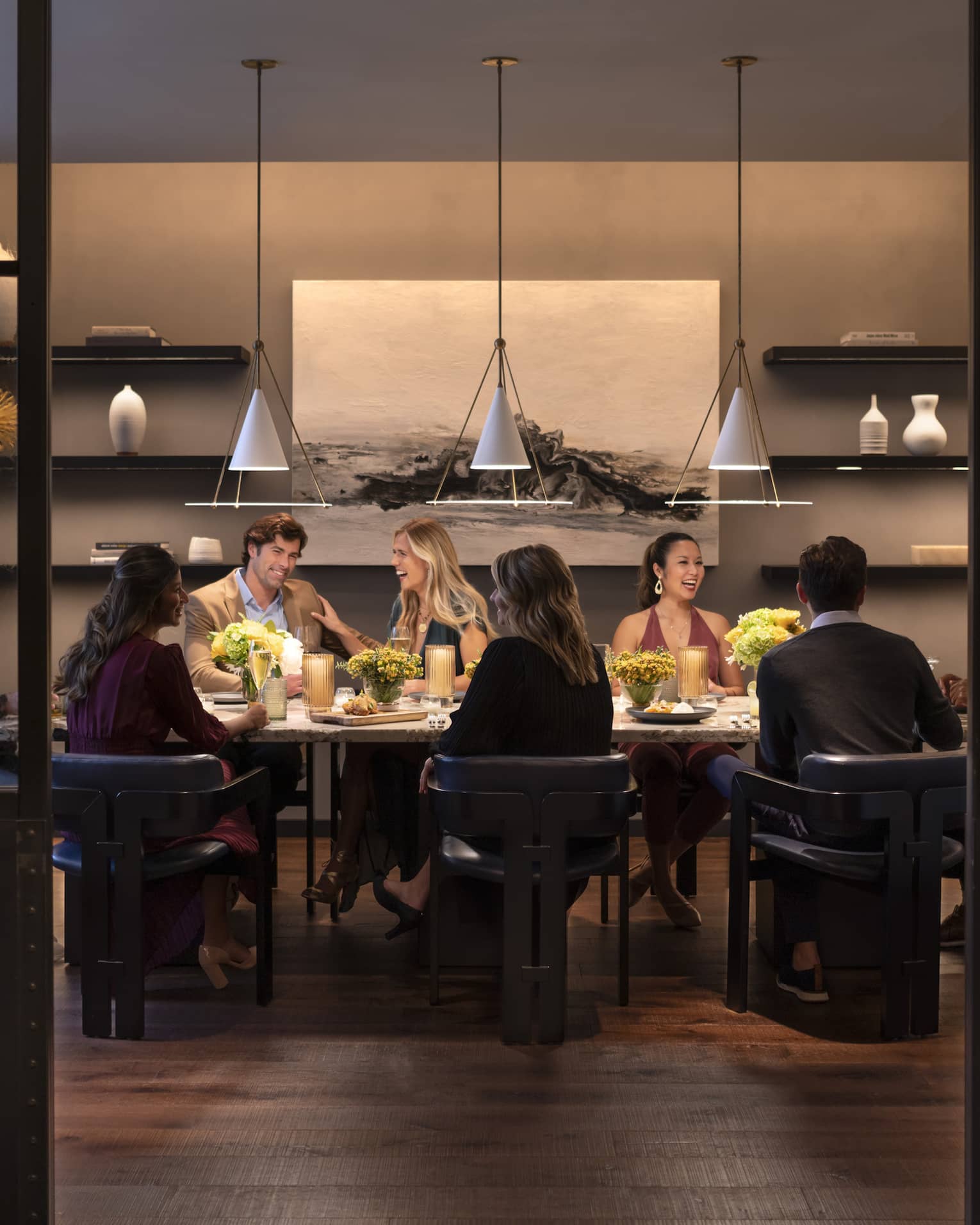 Interior of restaurant with group eating at table