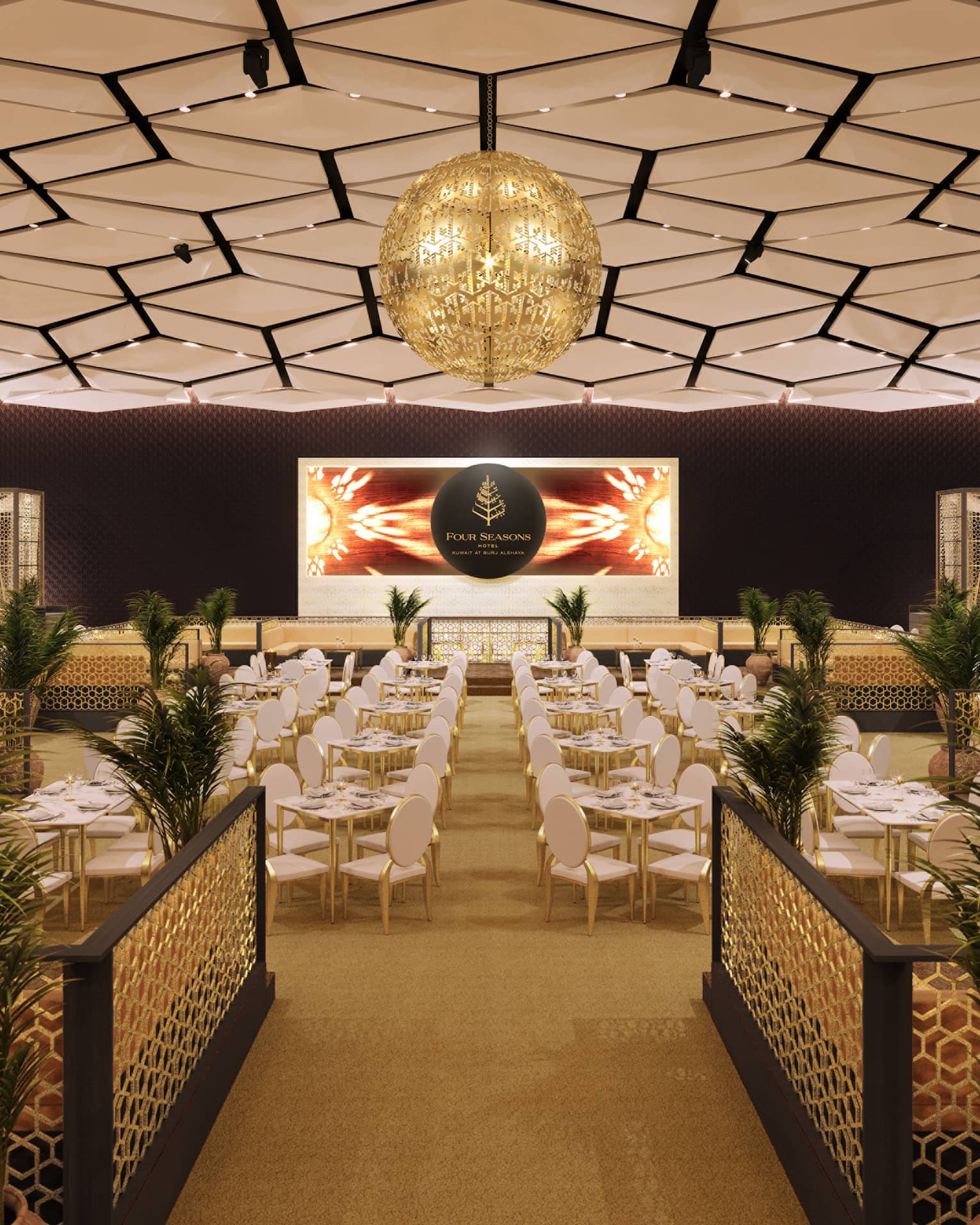 An overview of a function room with a hexagonal design on the ceiling, and gold accents on the furniture.