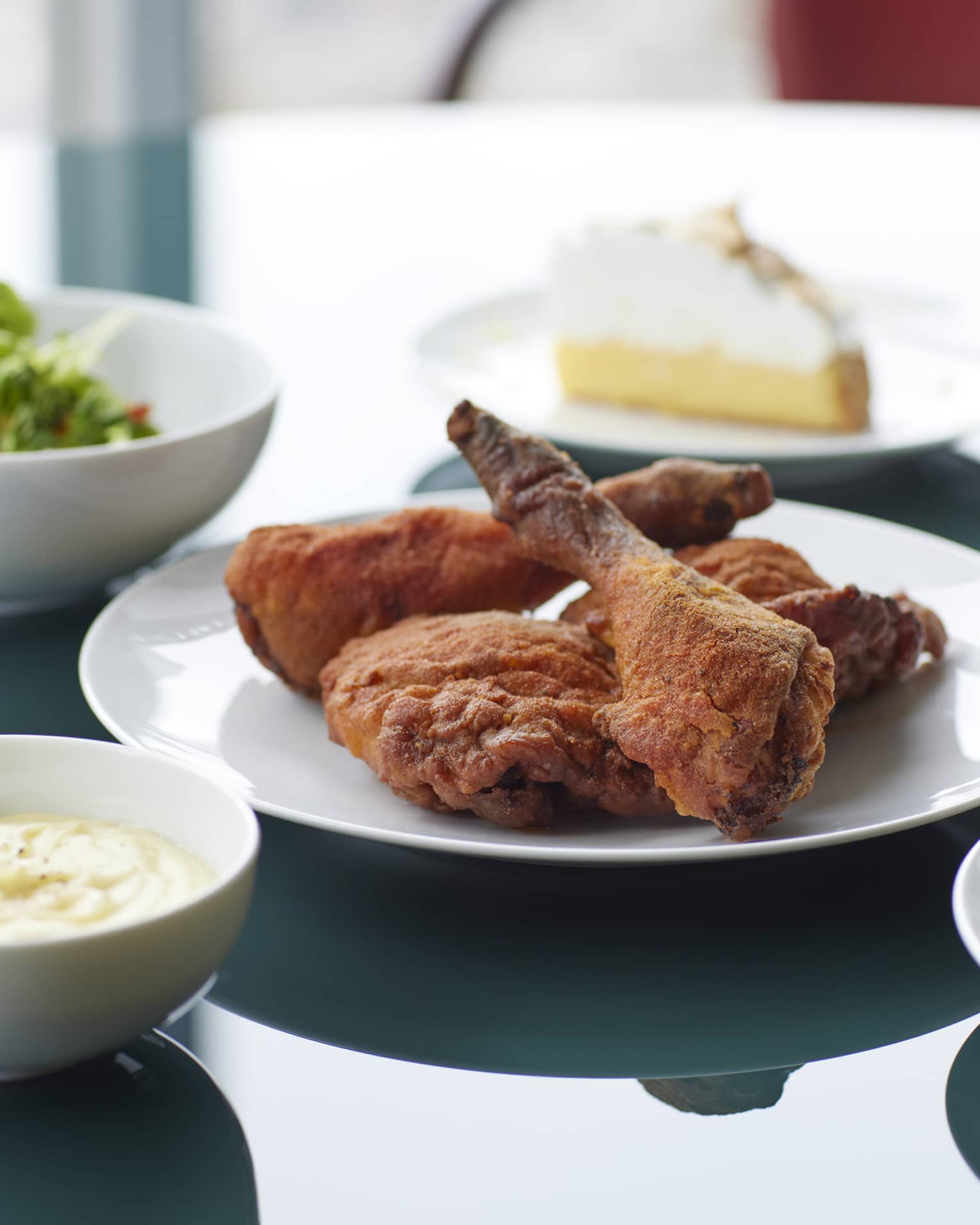 Marunouchi Fried Chicken with Cobb Salad & Kale Dressing, Braised Kale, Mashed Potatoes, Cornbread, House-made Pickles, Ranch Dressing and Lemon Meringue Pie