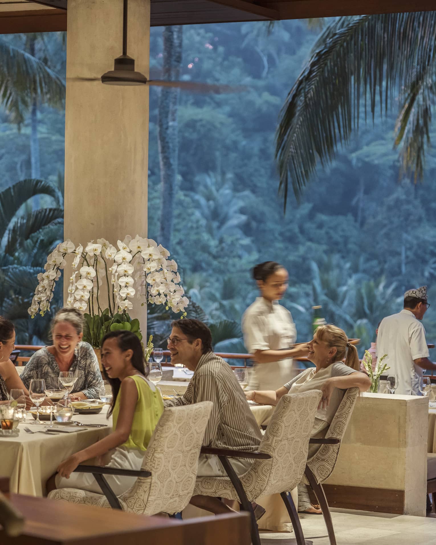 Ayung Terrace open air restaurant dining room surrounded by large palms