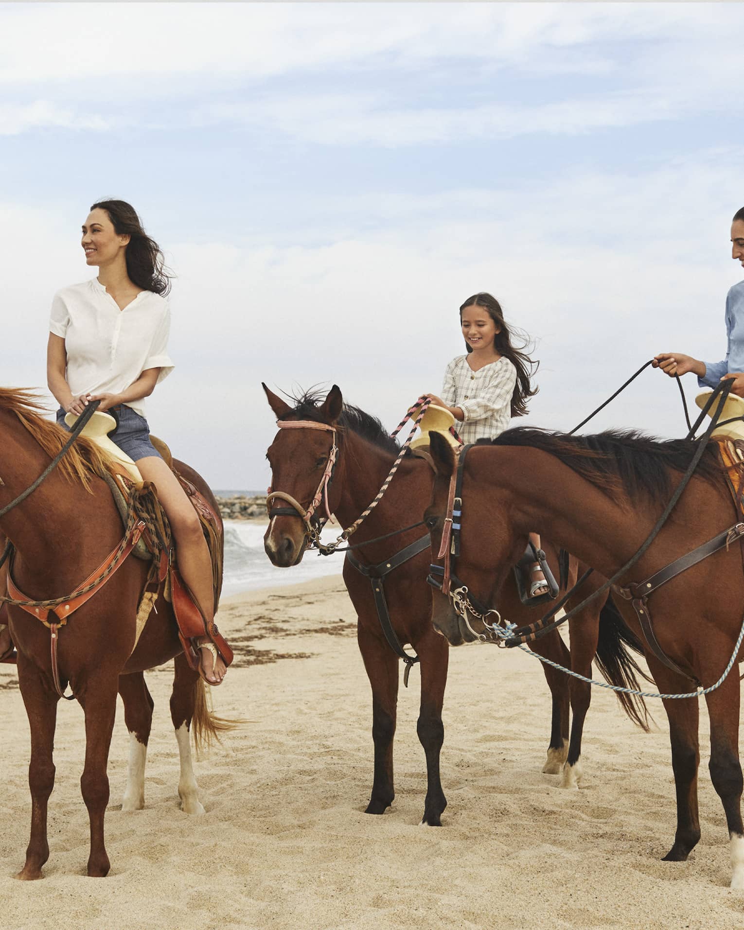 Three women riding on horses.