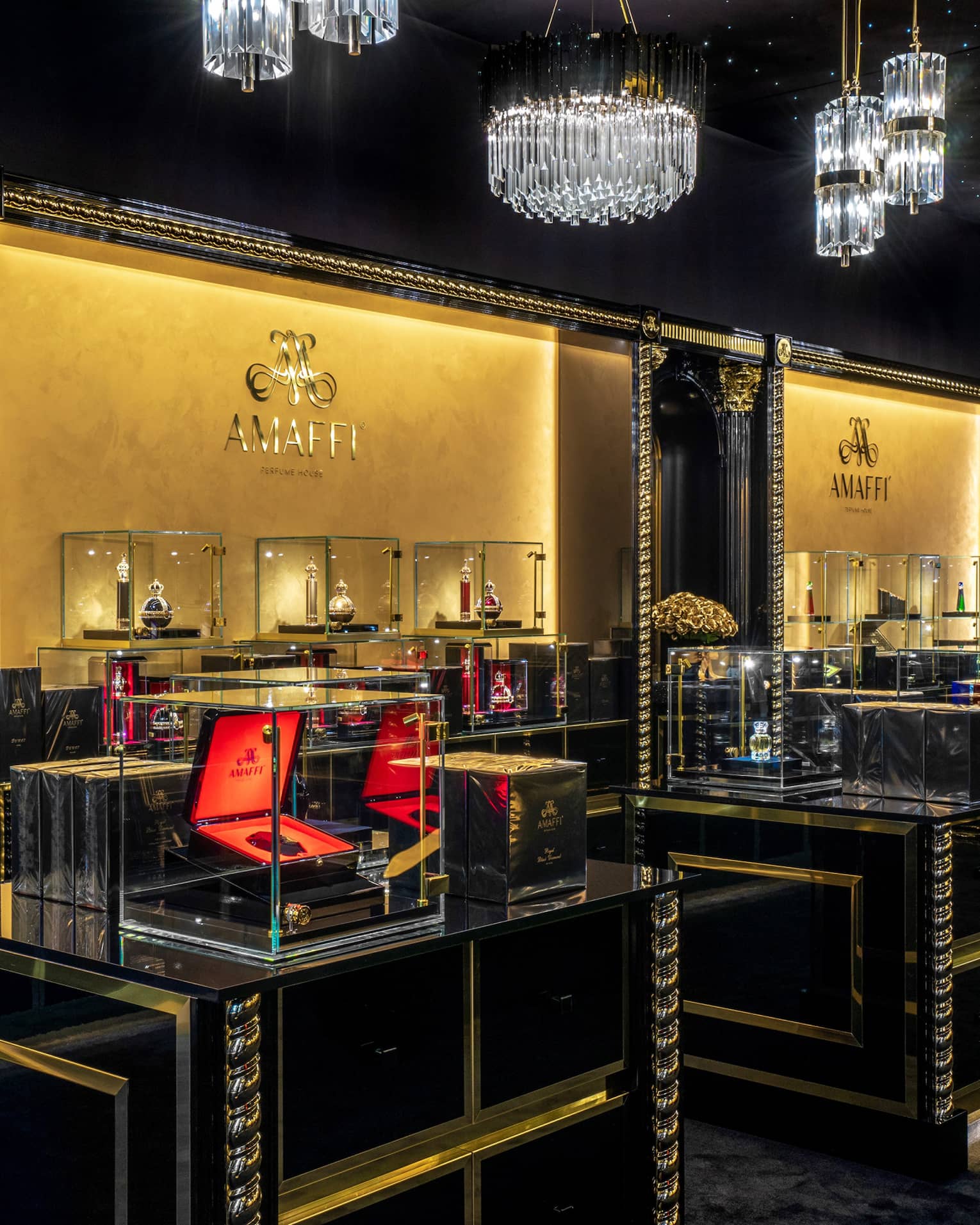 AMAFFI boutique interior with glass cases and crystal chandeliers