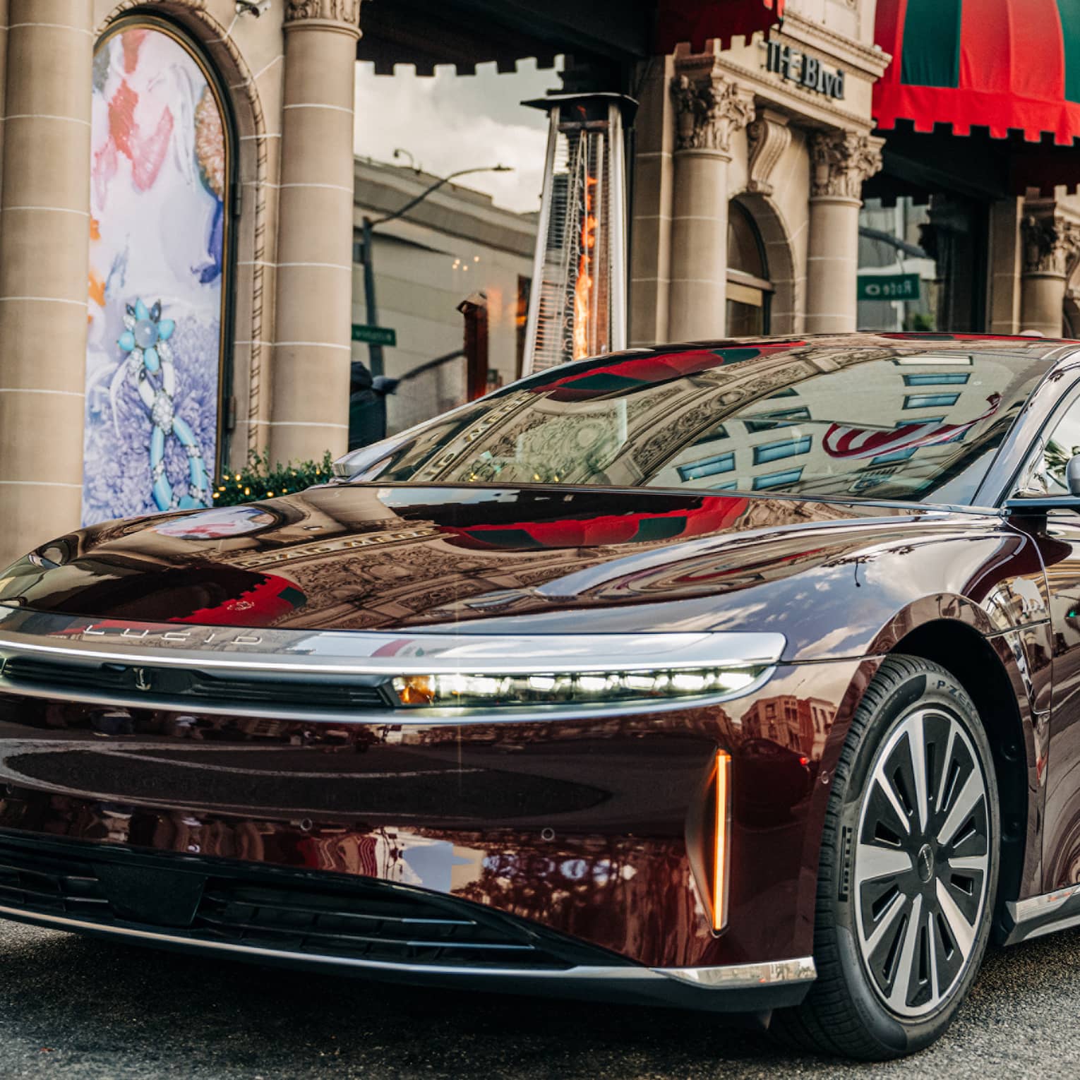 A hotel car parked on the street outside of the hotel