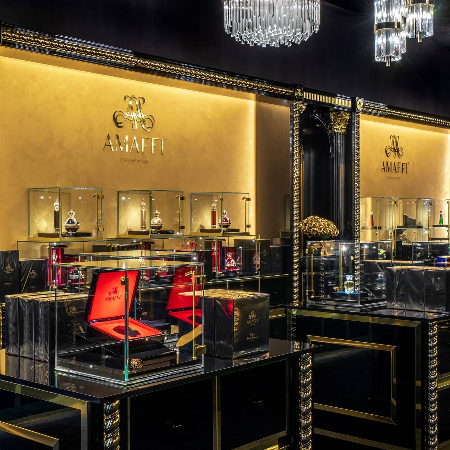 AMAFFI boutique interior with glass cases and crystal chandeliers