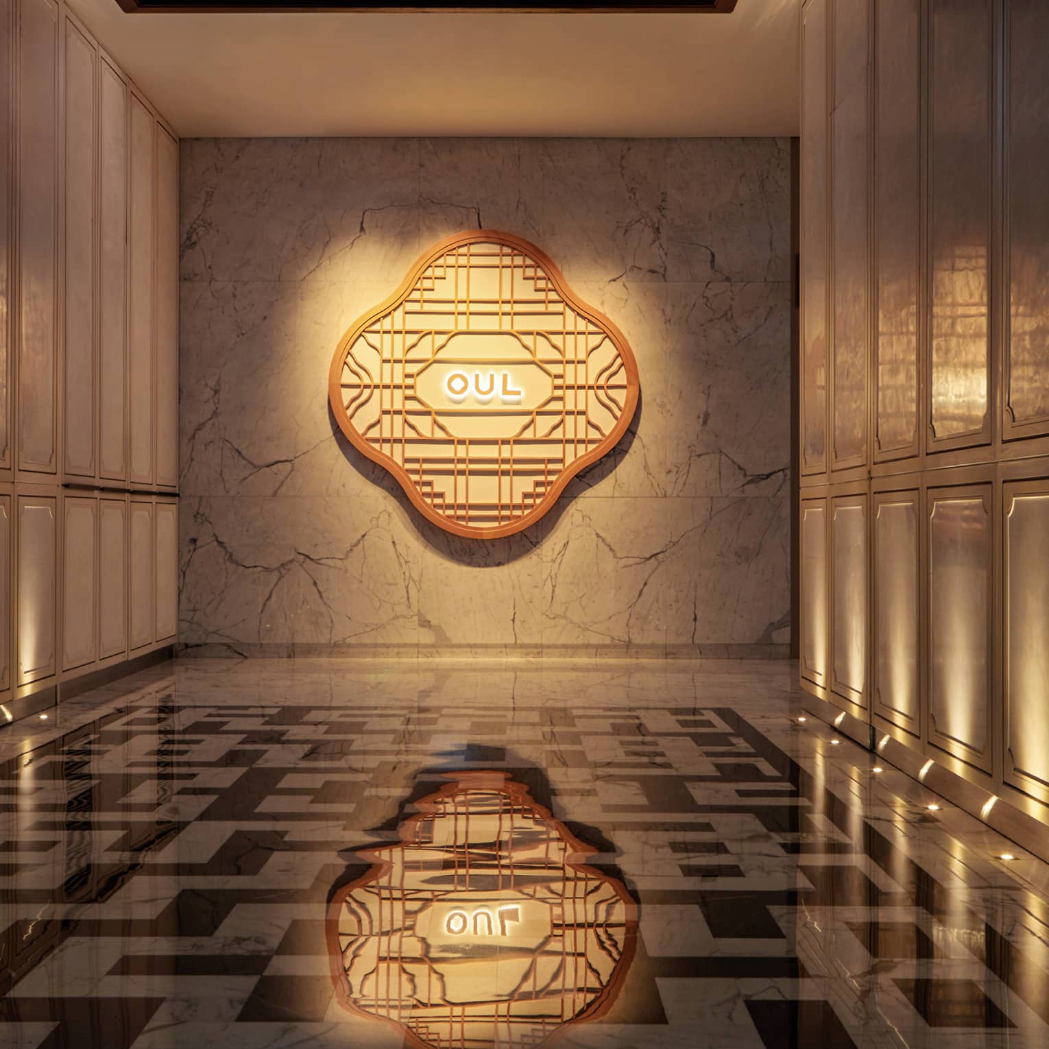 Illuminated hallway and sign for OUL, black-and-white checkered floor