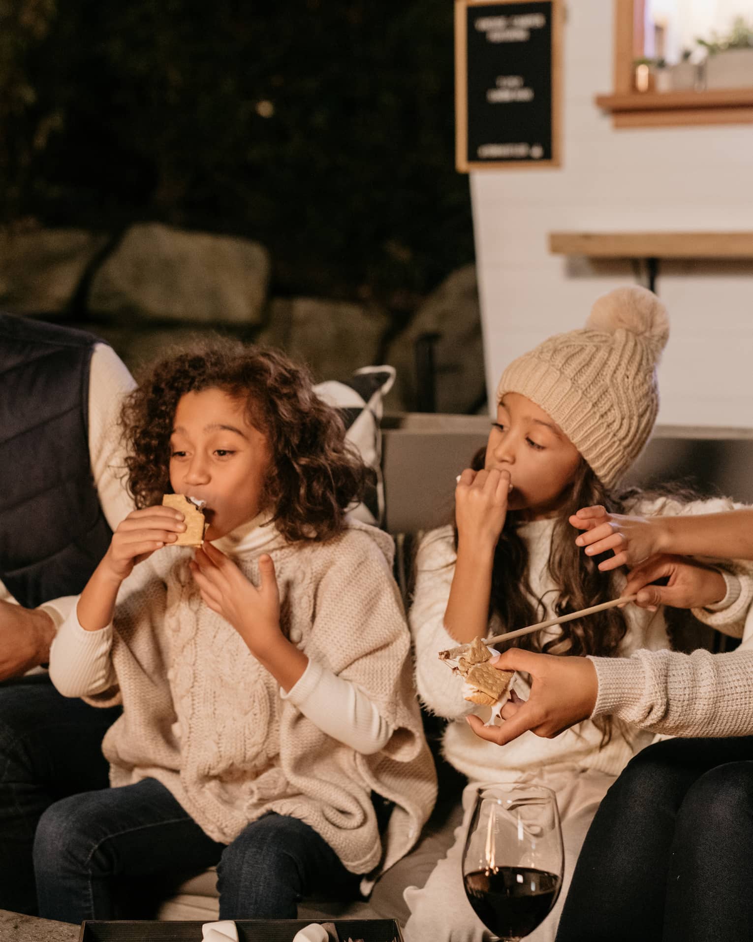A family enjoying snacks and drinks.