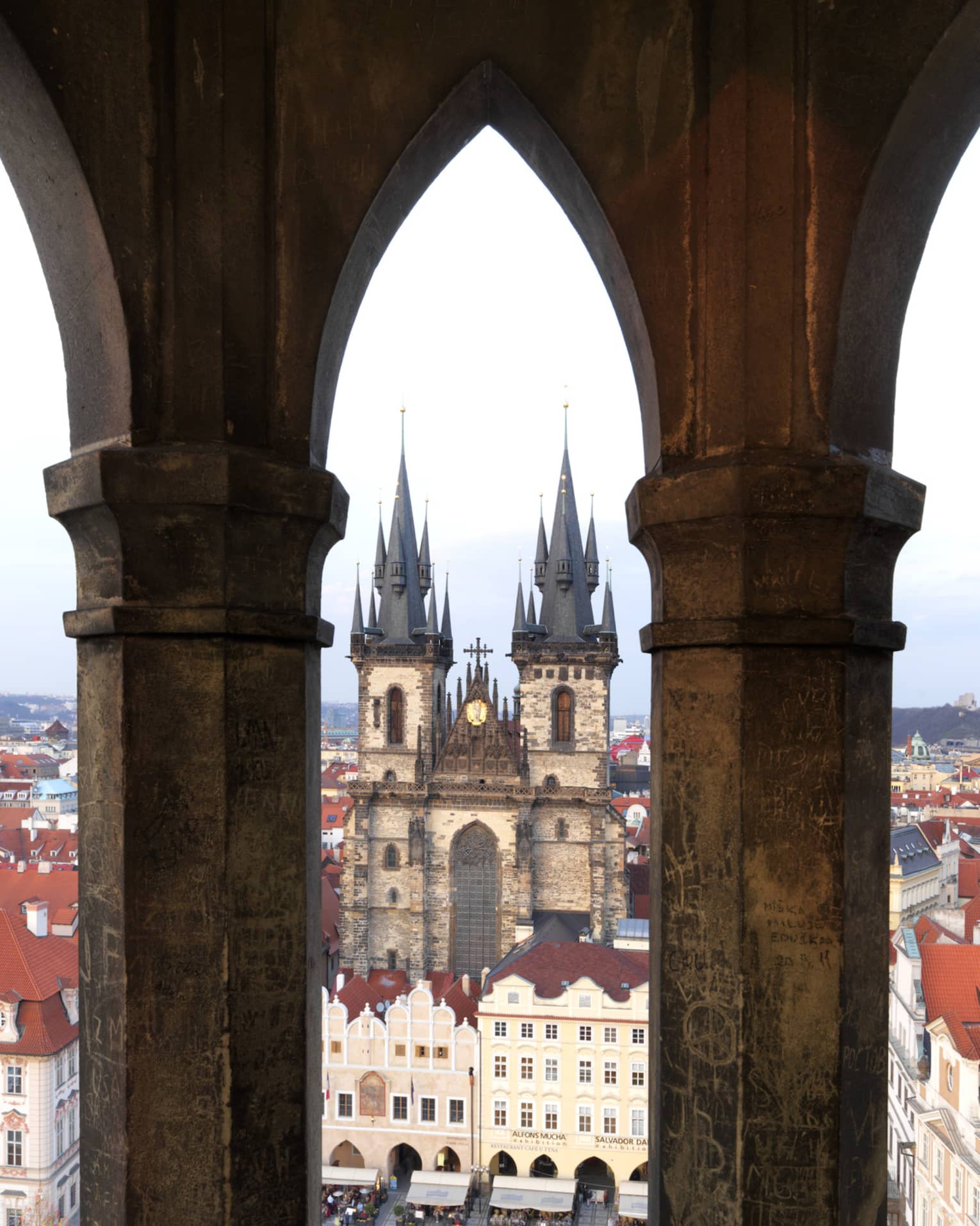 Old Town Prague, view past historic posts over city rooftops