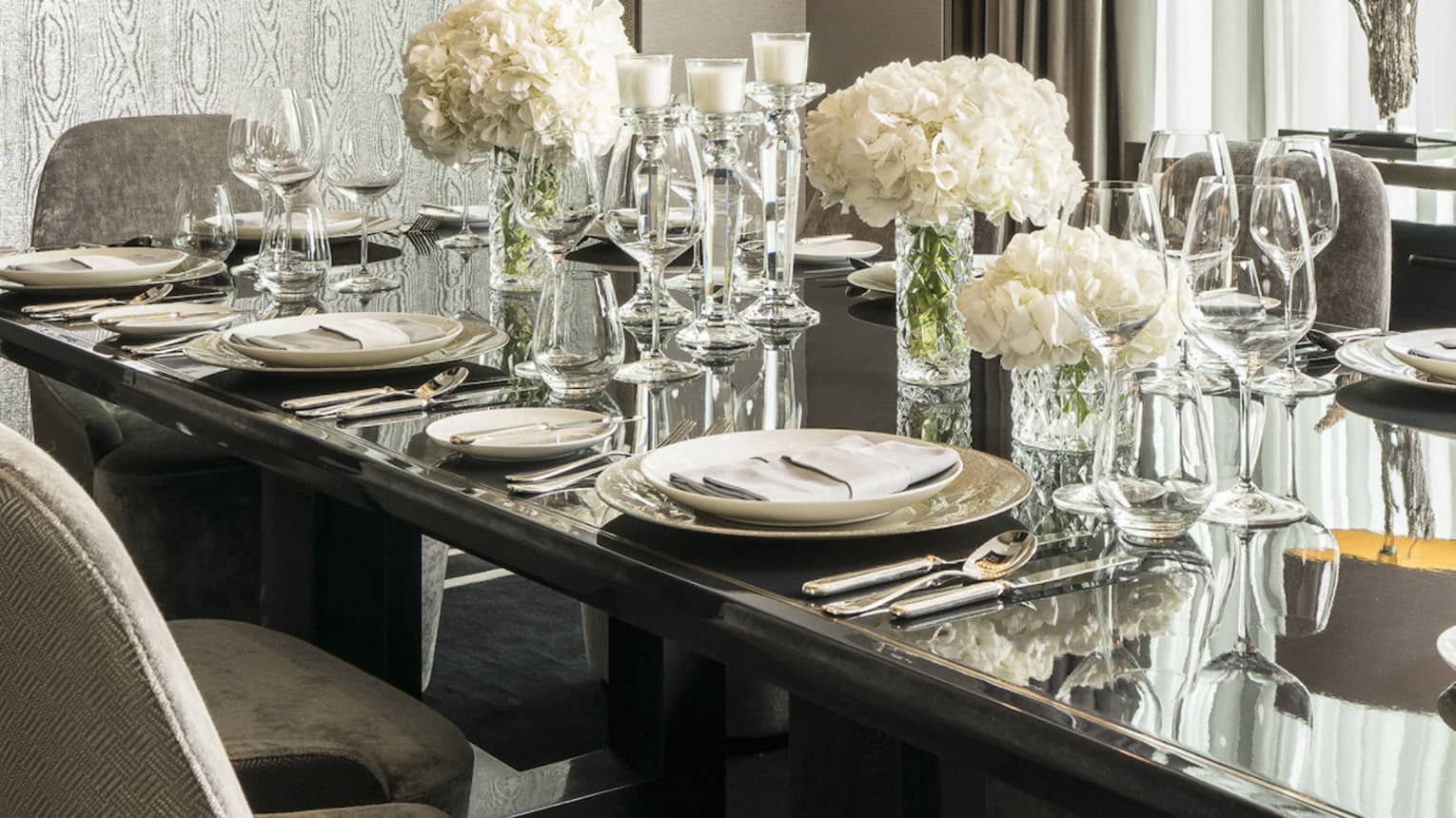Royal Suite dining table with crystal glassware, dishes, white flowers