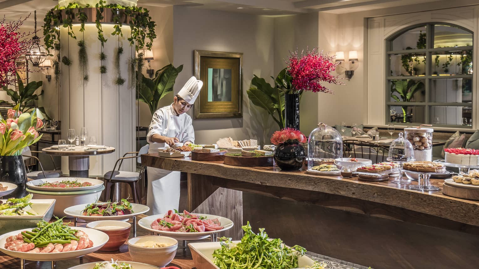 A lunch buffet arranged with platters of seafood, fresh vegetables and a large variety of other options at the One Ninety Restaurant
