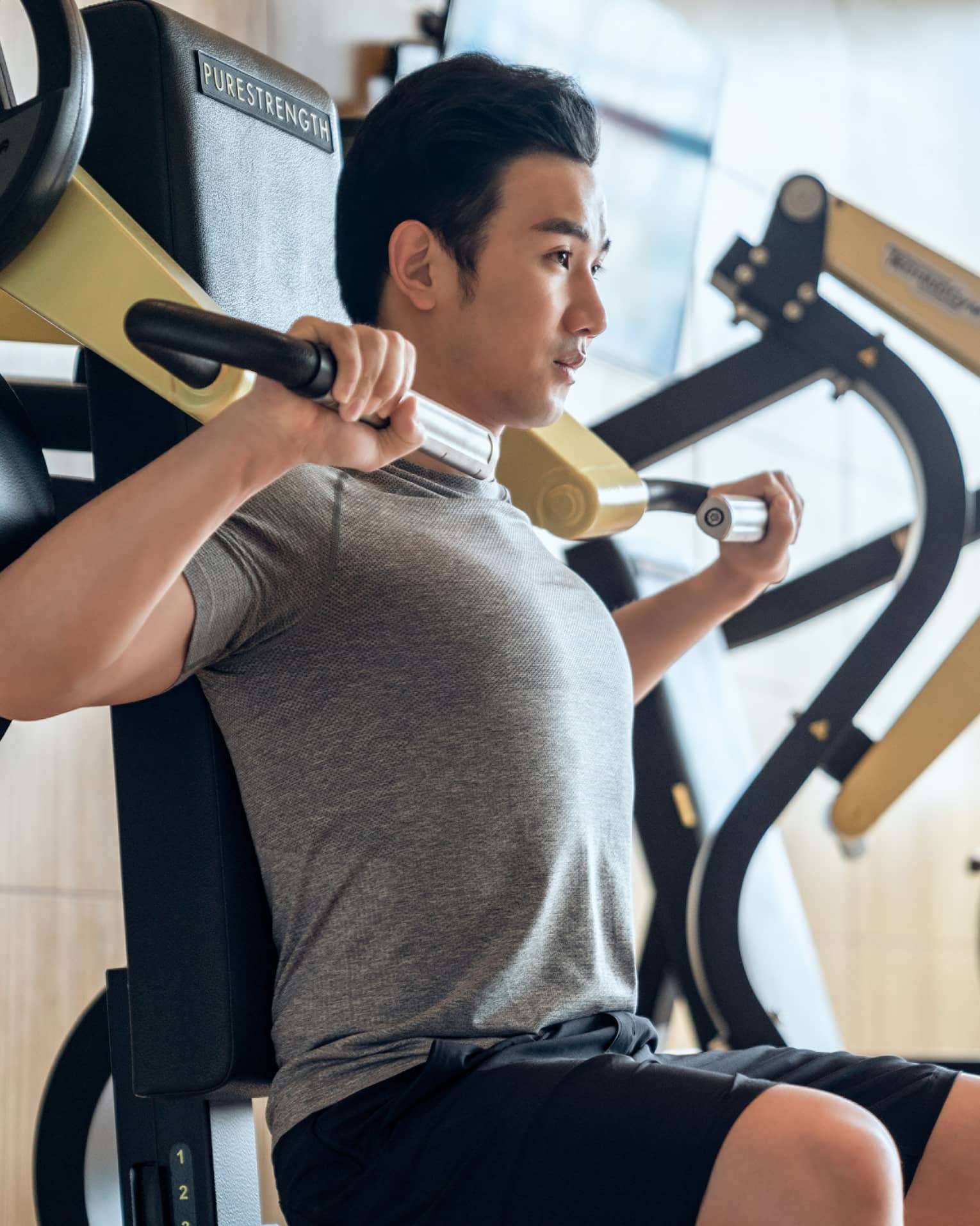 Guest using fitness equipment in gym at Four Seasons