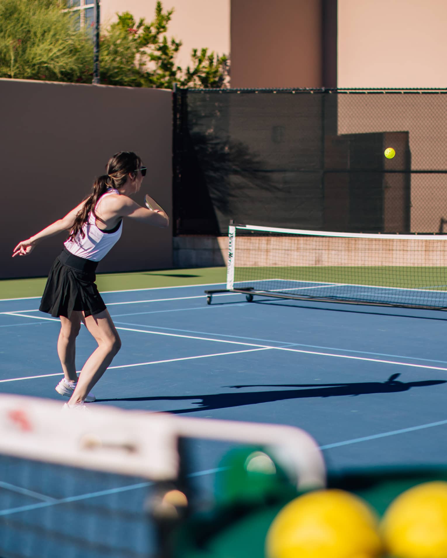 A woman and man on a tennis court.