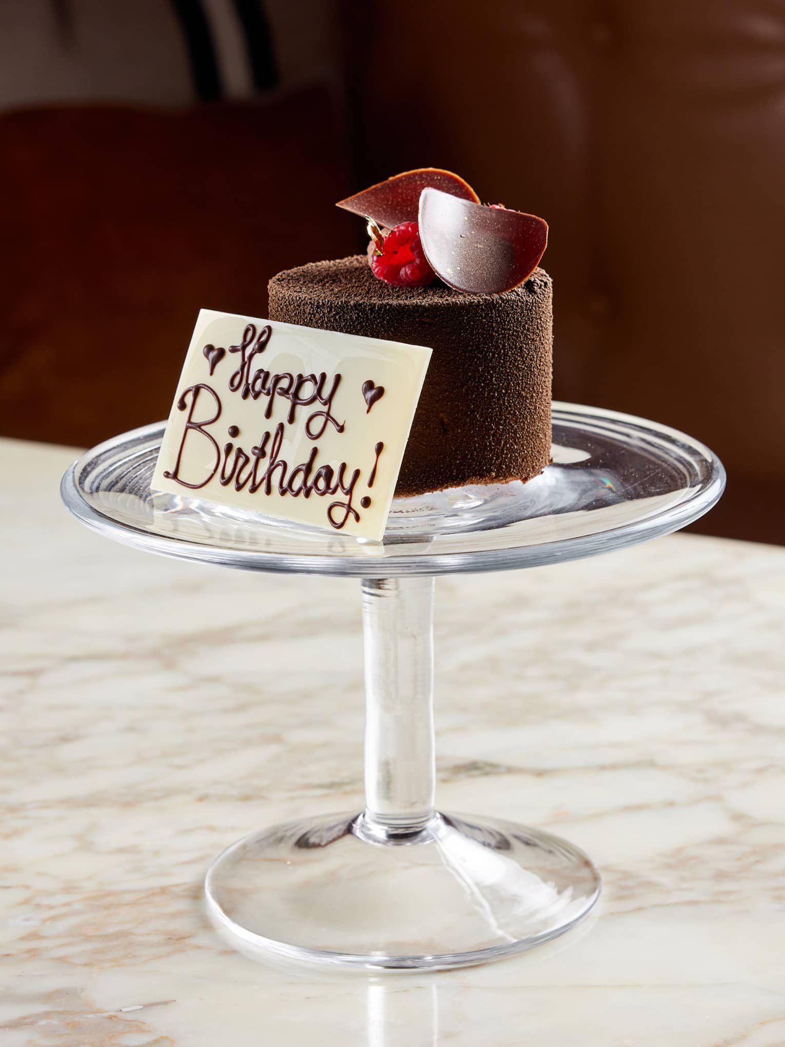 A small chocolate dessert on a tray.