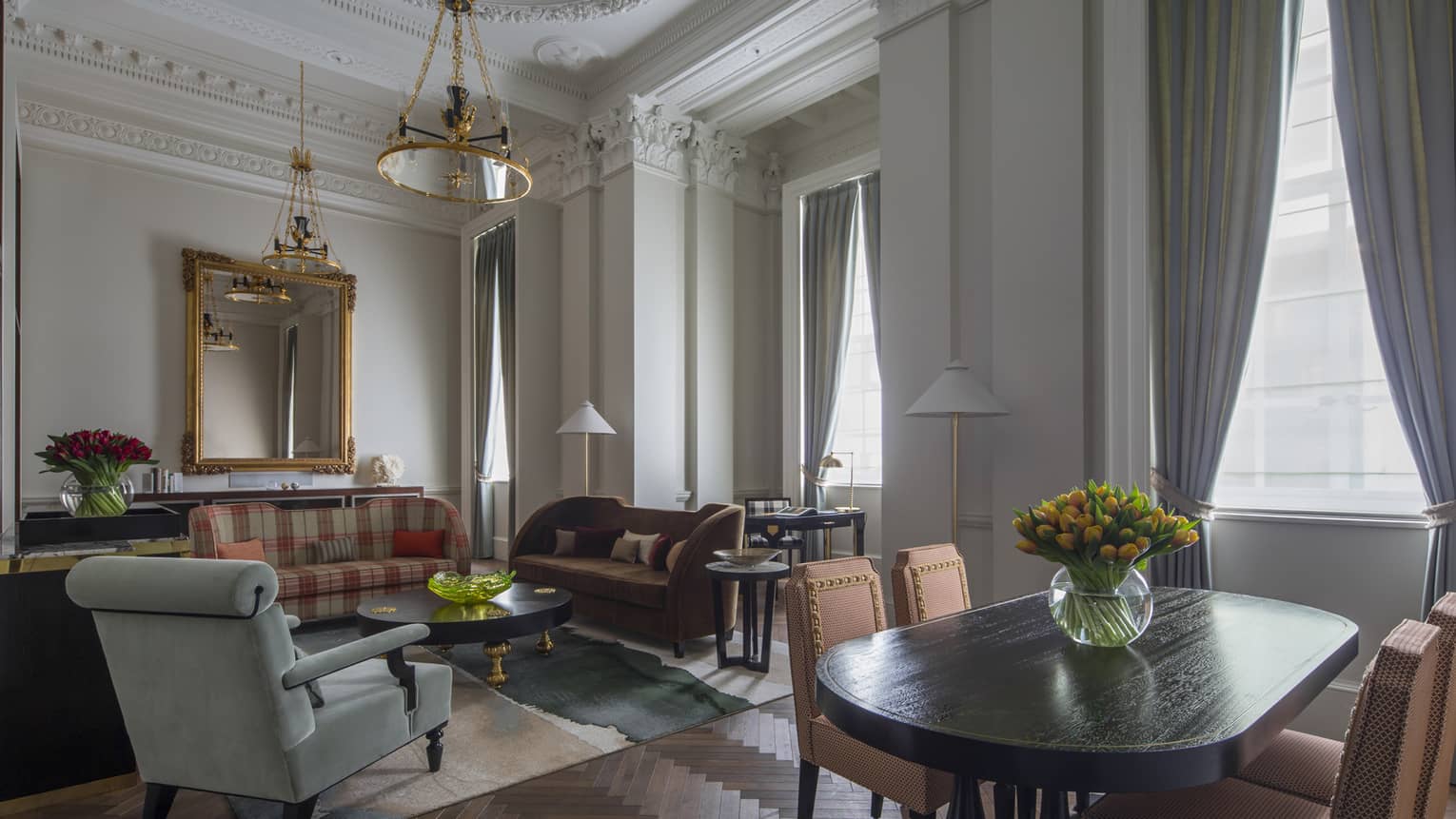 Heritage Suite dining table, seating area by tall, sunny windows 