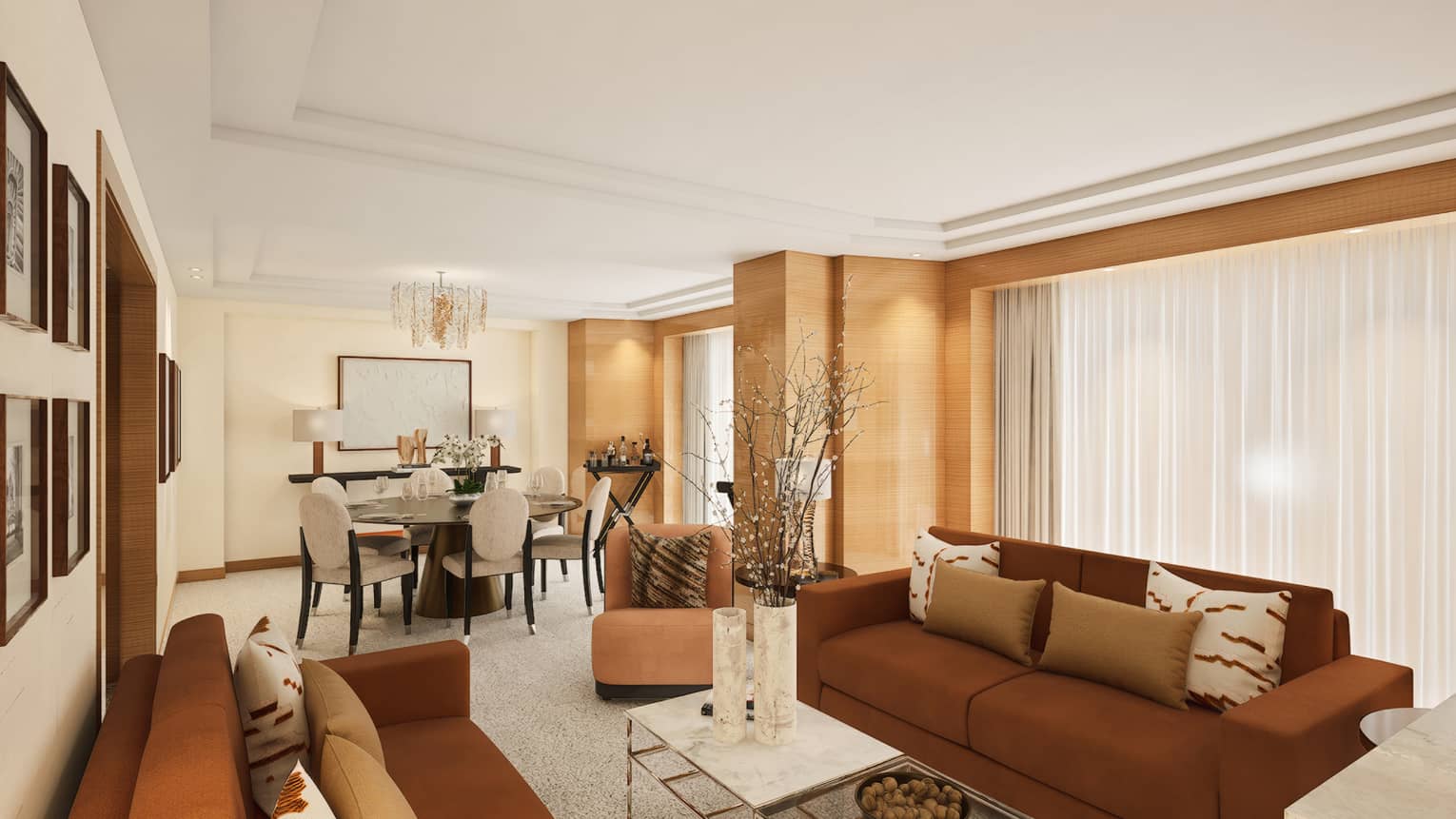 Hotel suite living room with two brown sofas facing inward toward coffee table, plus a dining table