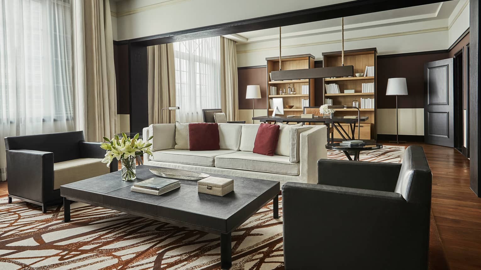Bright Governor Suite sofa and two armchairs by coffee table, brown-and-white rug