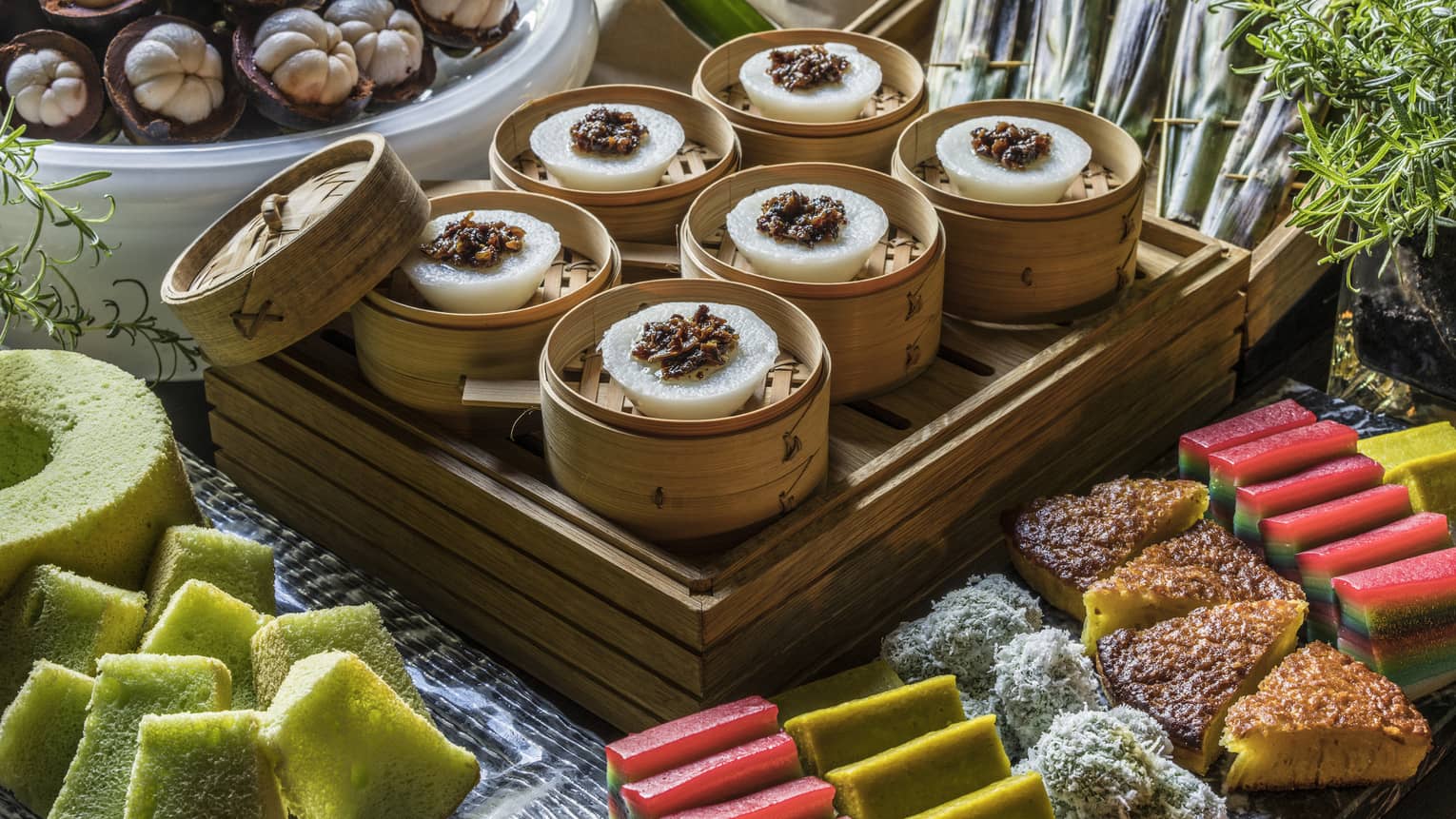 An array of vibrantly colored sponge cakes, lemon bars and other assorted pastries 