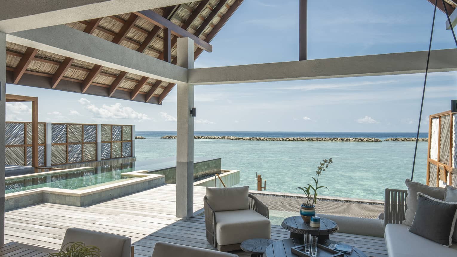 Sunrise Water Villa With Pool outdoor covered patio with swing and chair, ocean views, pool