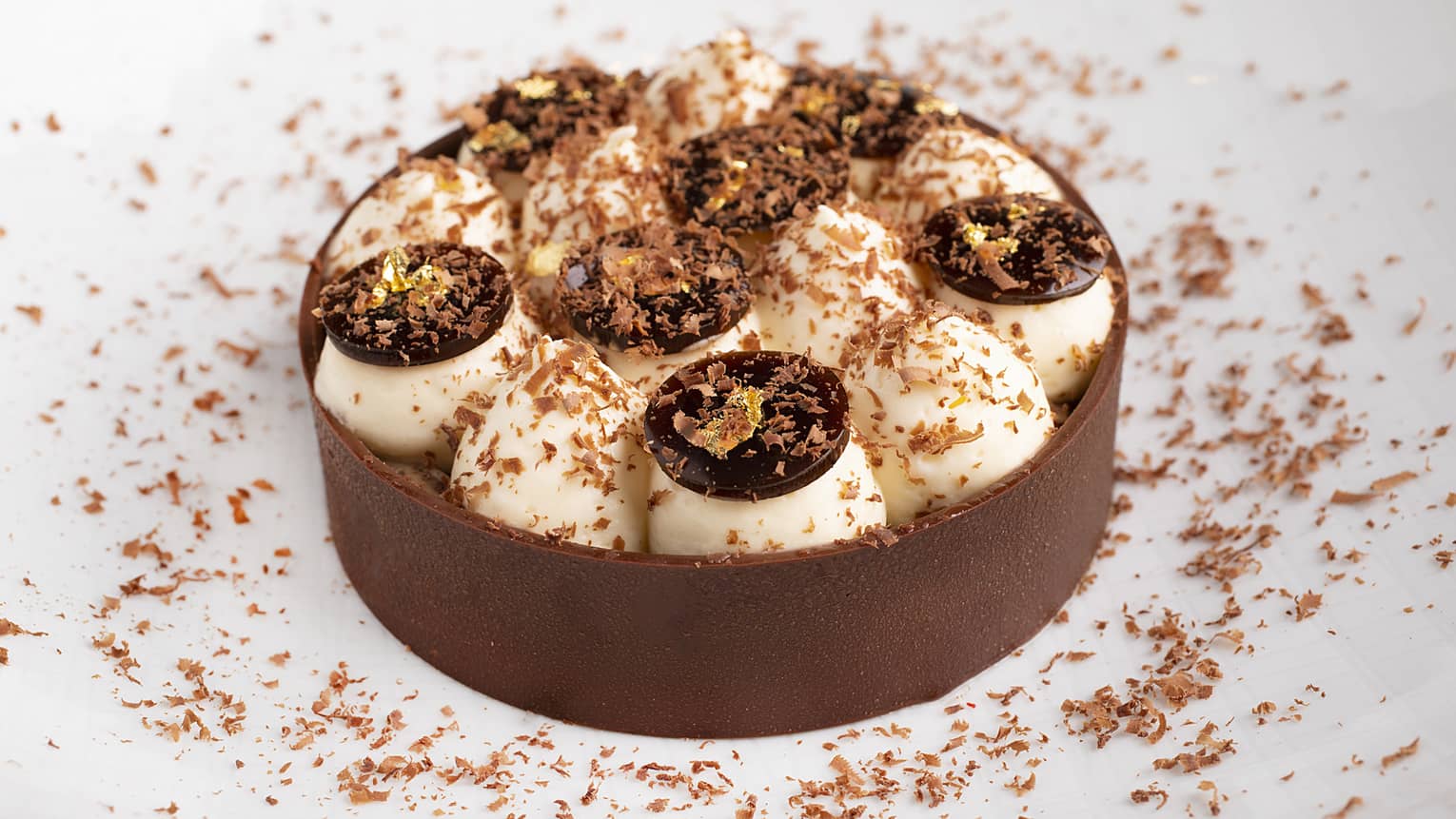 A tiramisu stuffed with cream and chocolate, then coated in chocolate scrapings.