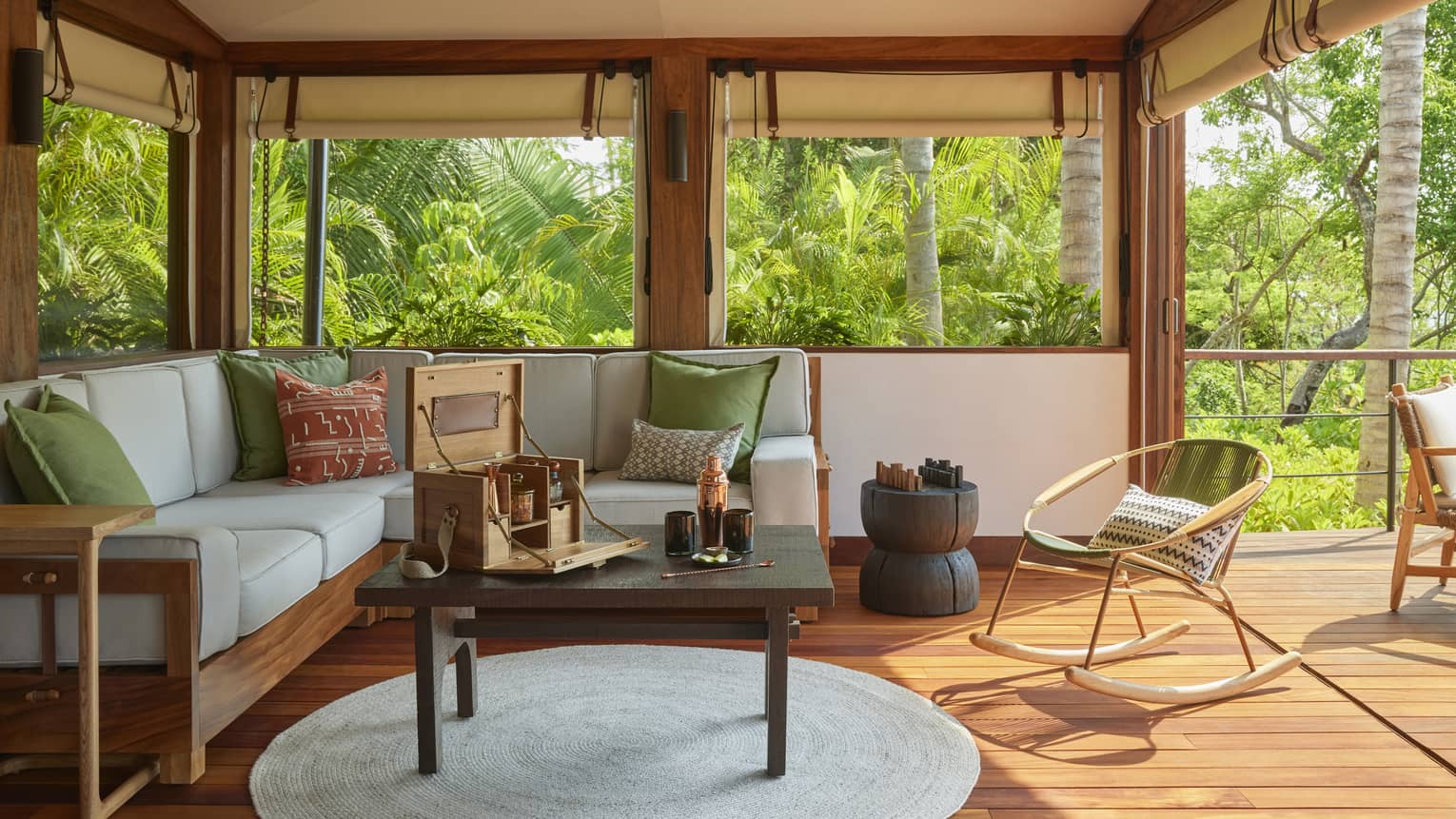 Living room of luxury tent with sofa, coffee table and wooden floors