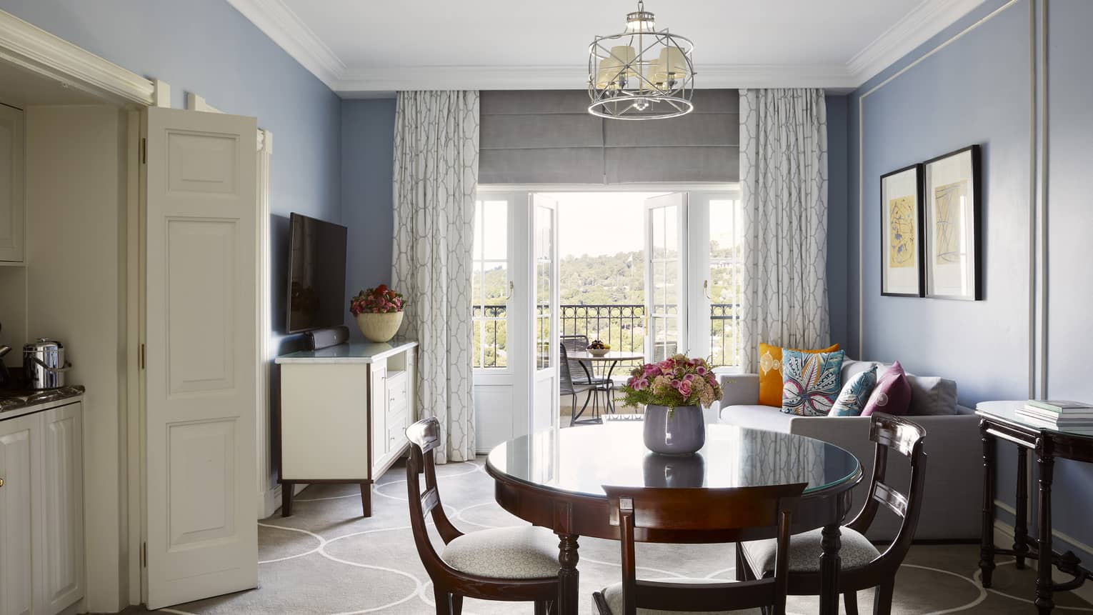 Hotel suite living and dining room, with wooden table and four chairs, at Four Seasons Hotel Johannesburg