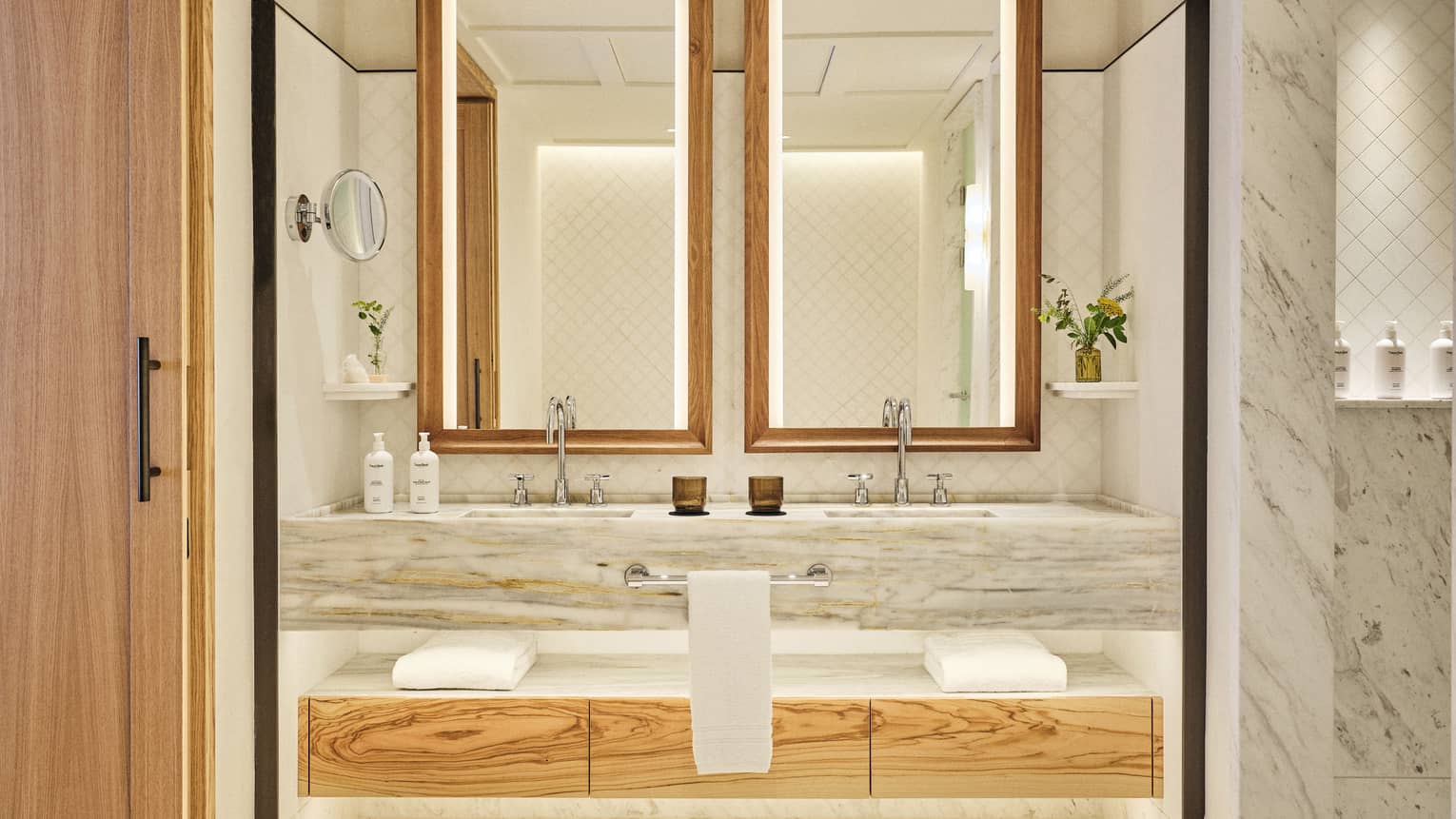 Illuminated marble vanity of luxury suite at Four Seasons Resort Mallorca