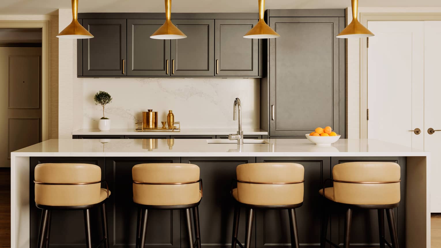 Contemporary kitchen with four counter seats at an island