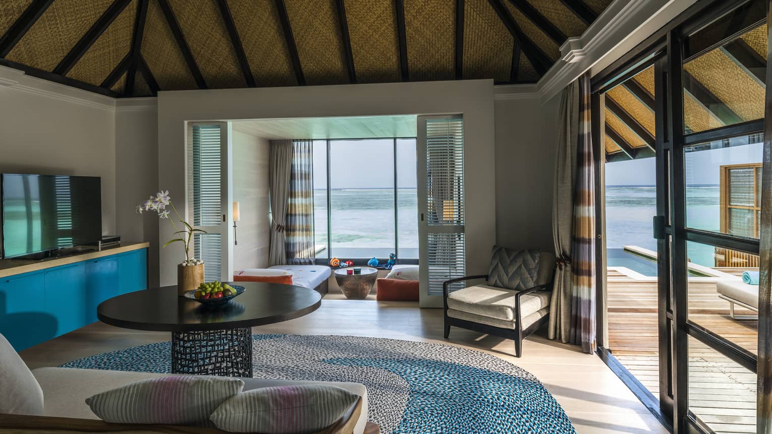 A family room and a kids' bedroom in a beautiful water villa 