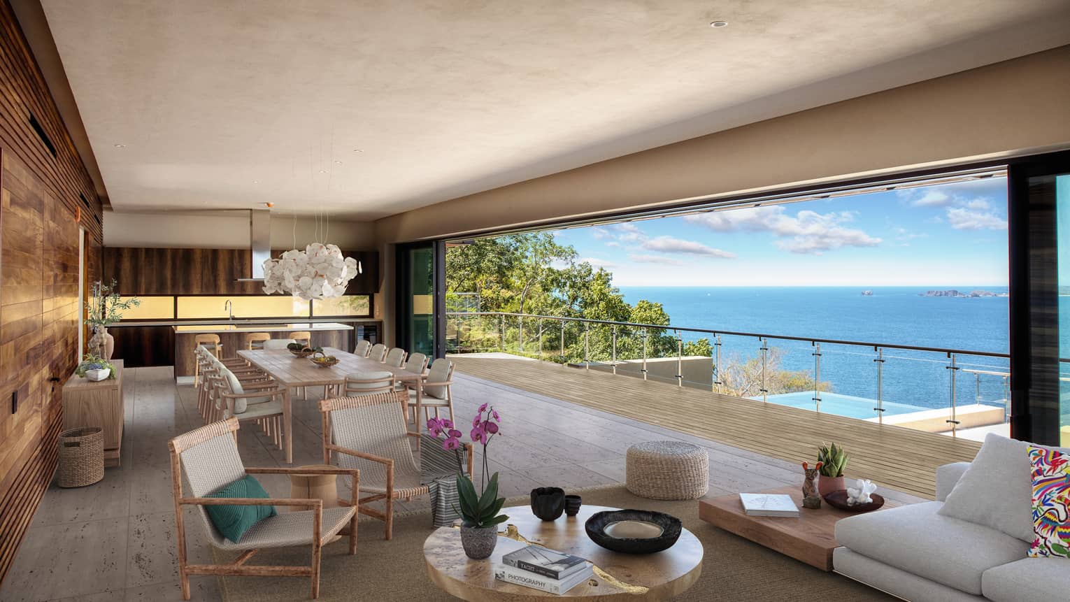 View of living room with open-air view of terrace and ocean