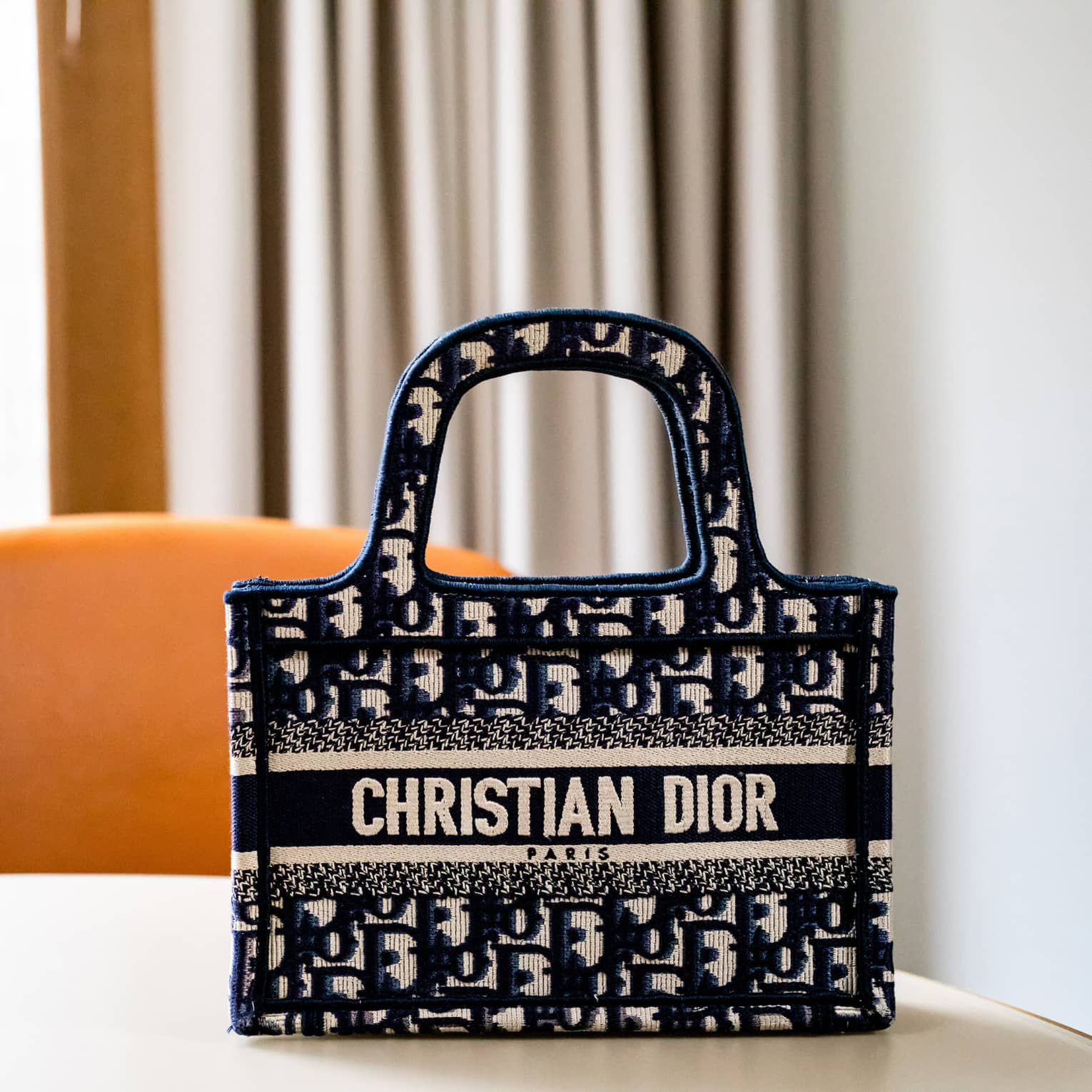 A bag with a Christian Dior label on it.