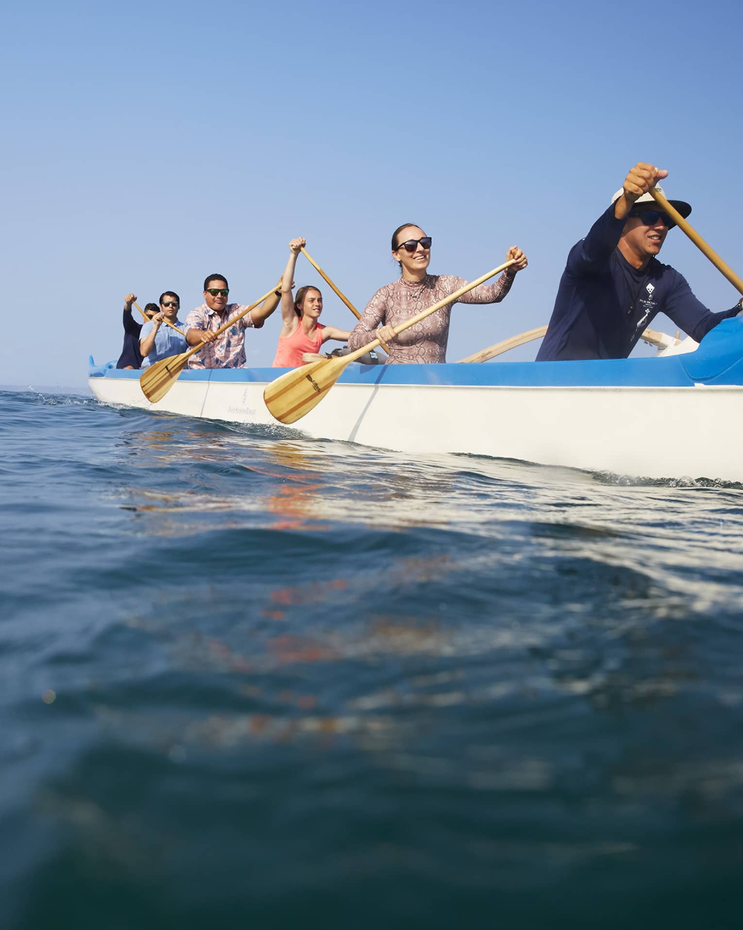 A group of guests kayaking on the ocean