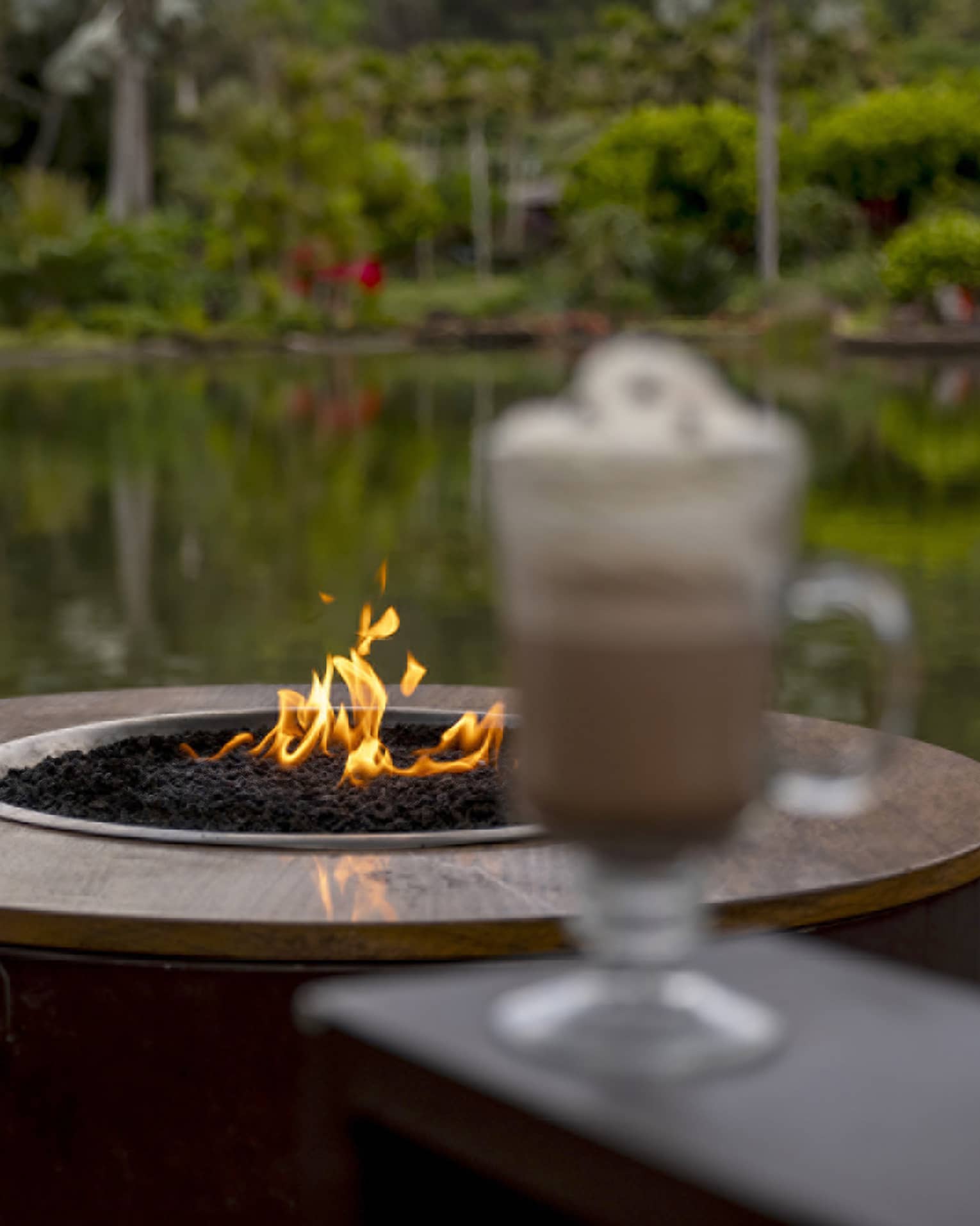 Outdoor, lakeside s'mores and hot chocolate on a deck