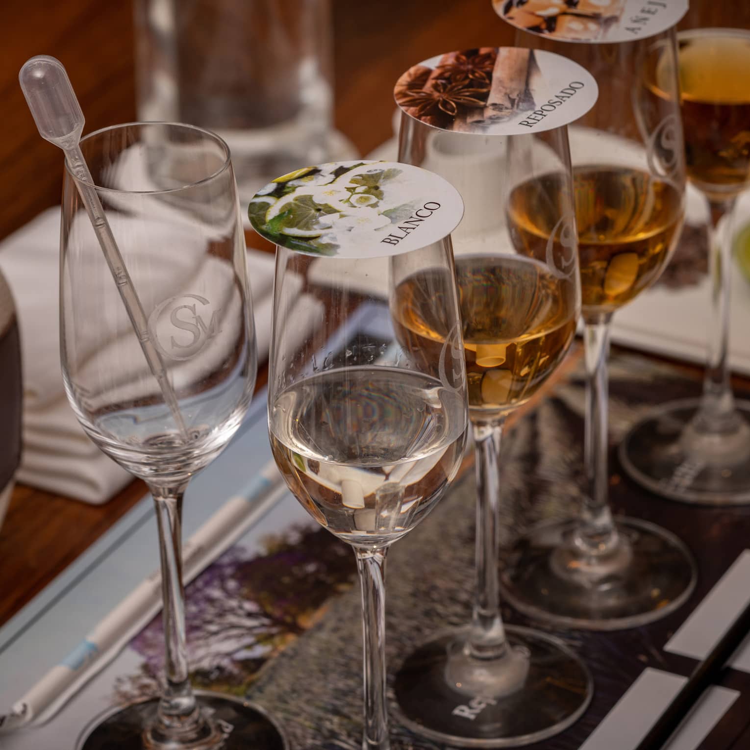 Blending tequila in glasses with covers.