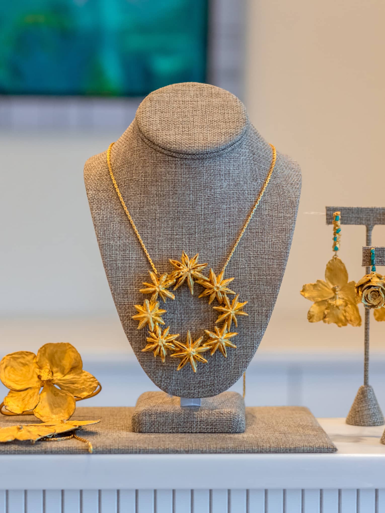 A display of gold necklaces and earrings