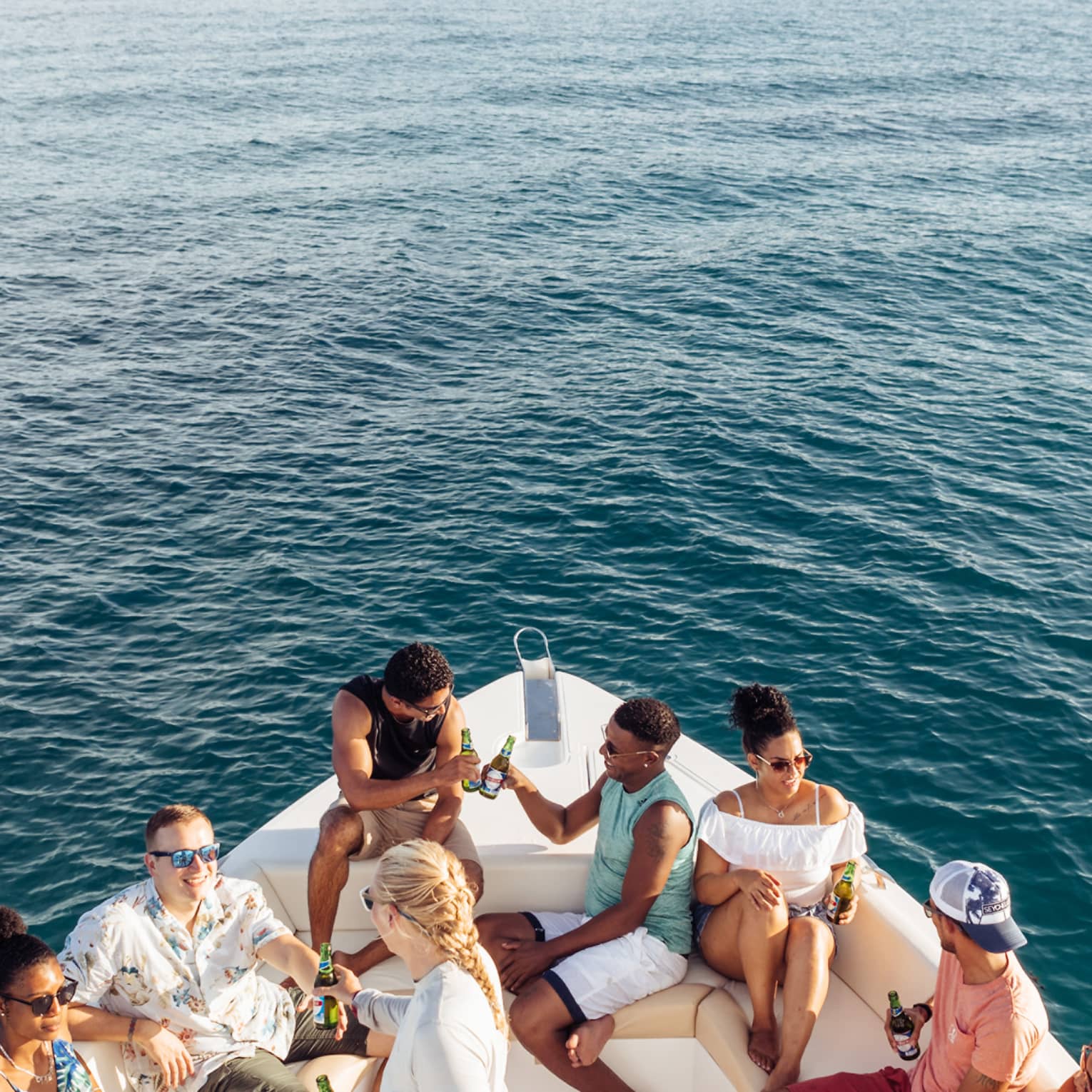 Group of friends enjoying a luxury boat cruise at sea