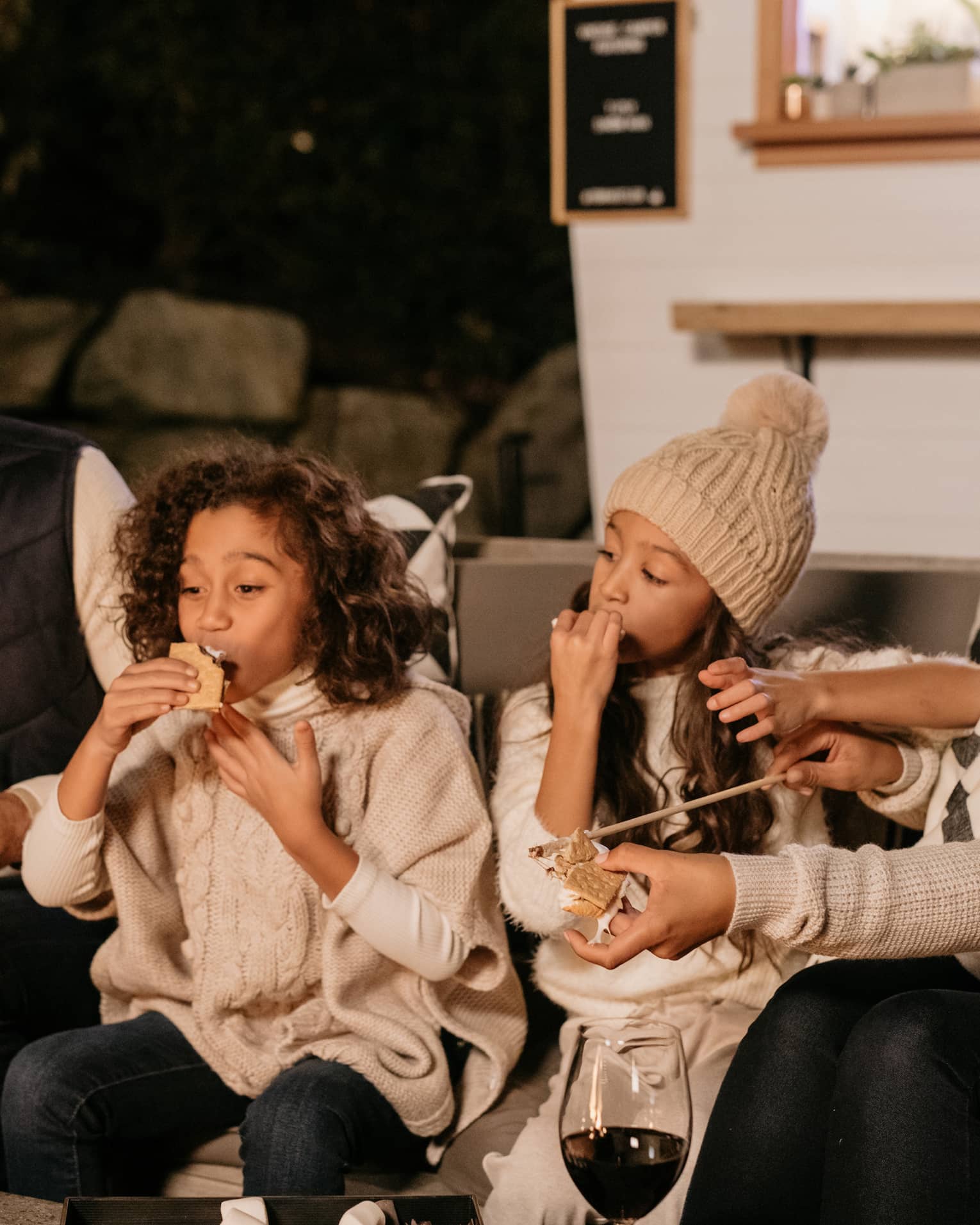 A family enjoying snacks and drinks.