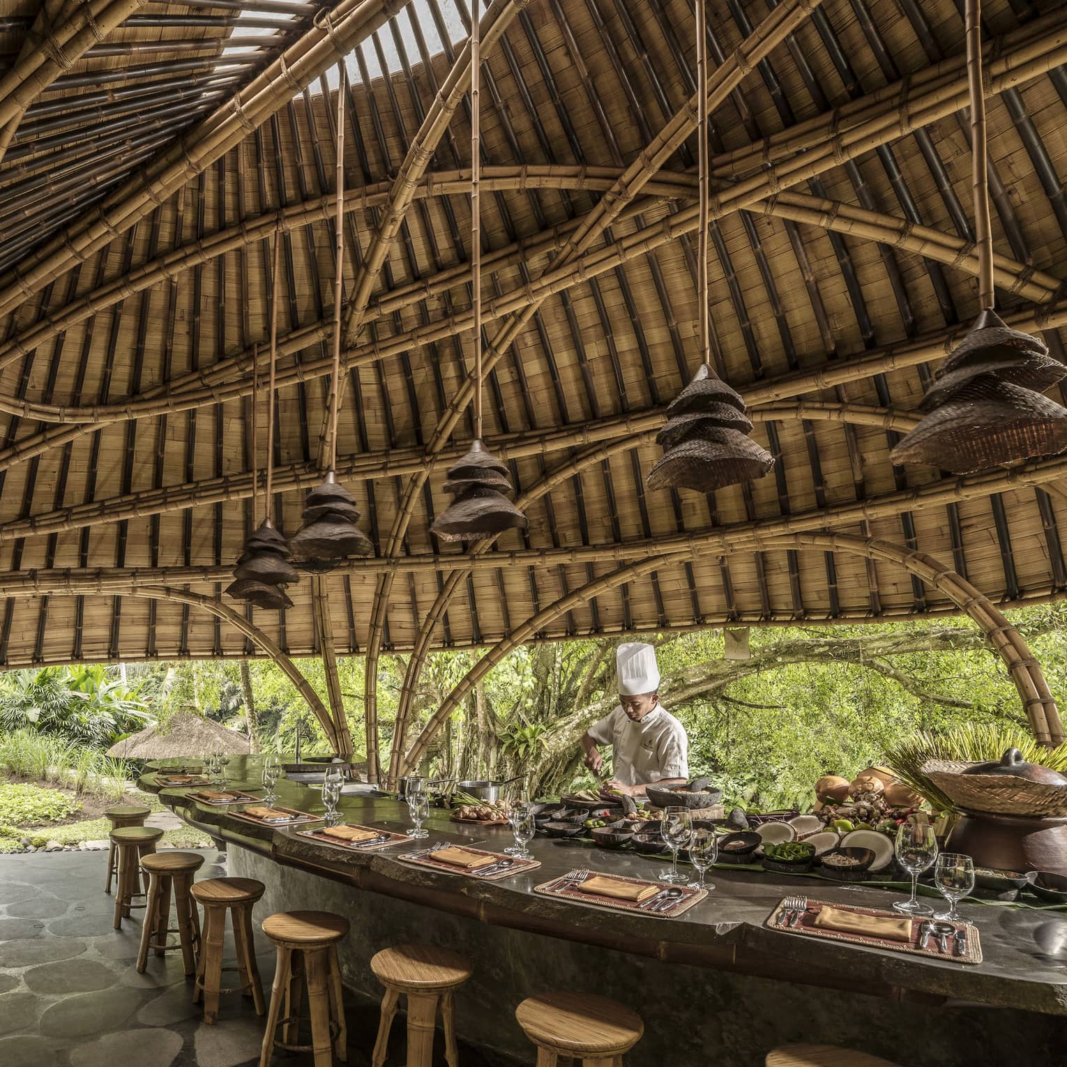 A chef prepares for Sokasi Cooking School in a bamboo pavillion